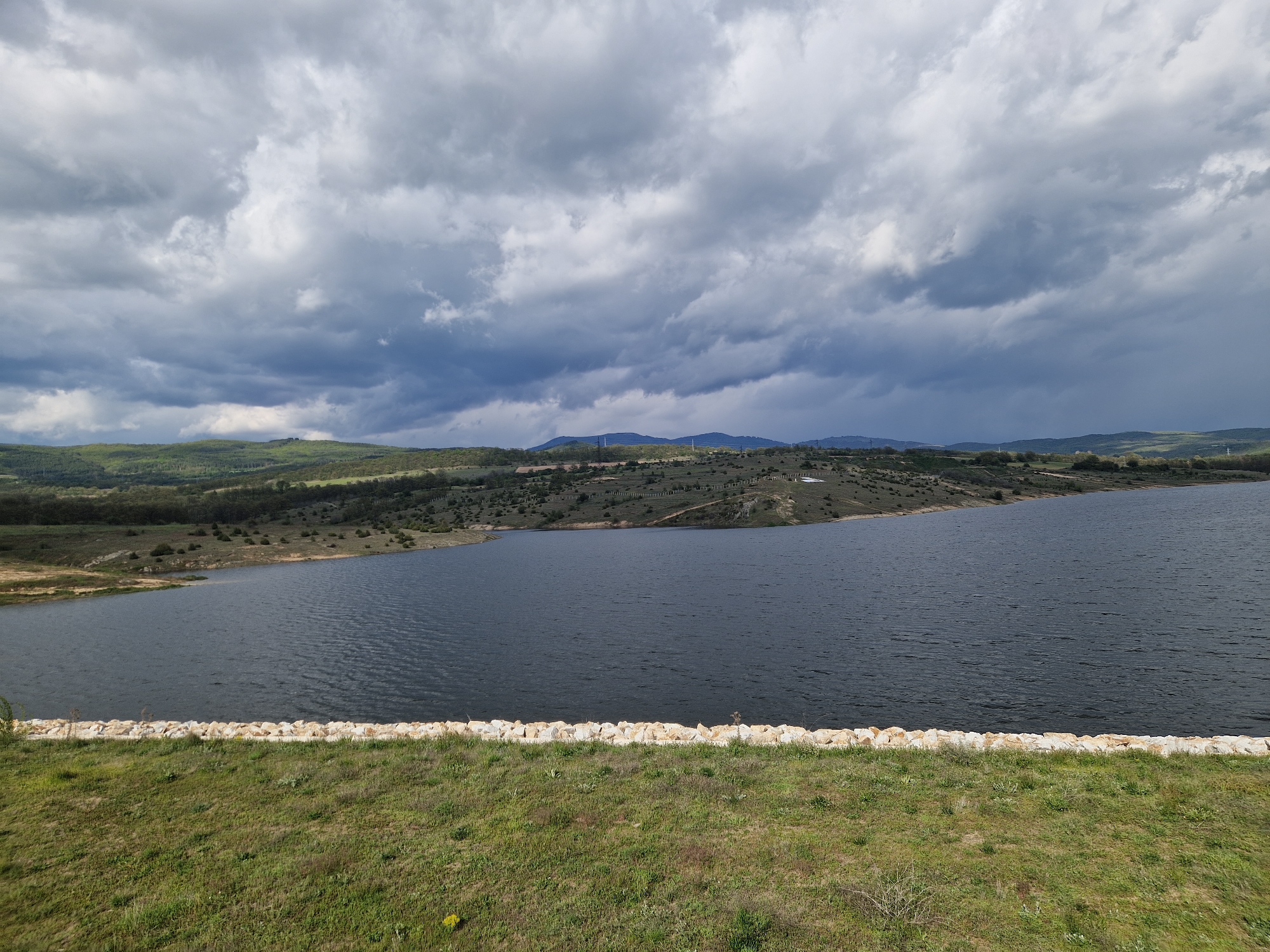 Witness documents scenic Panagyurishte landscape including lake and guitar sign