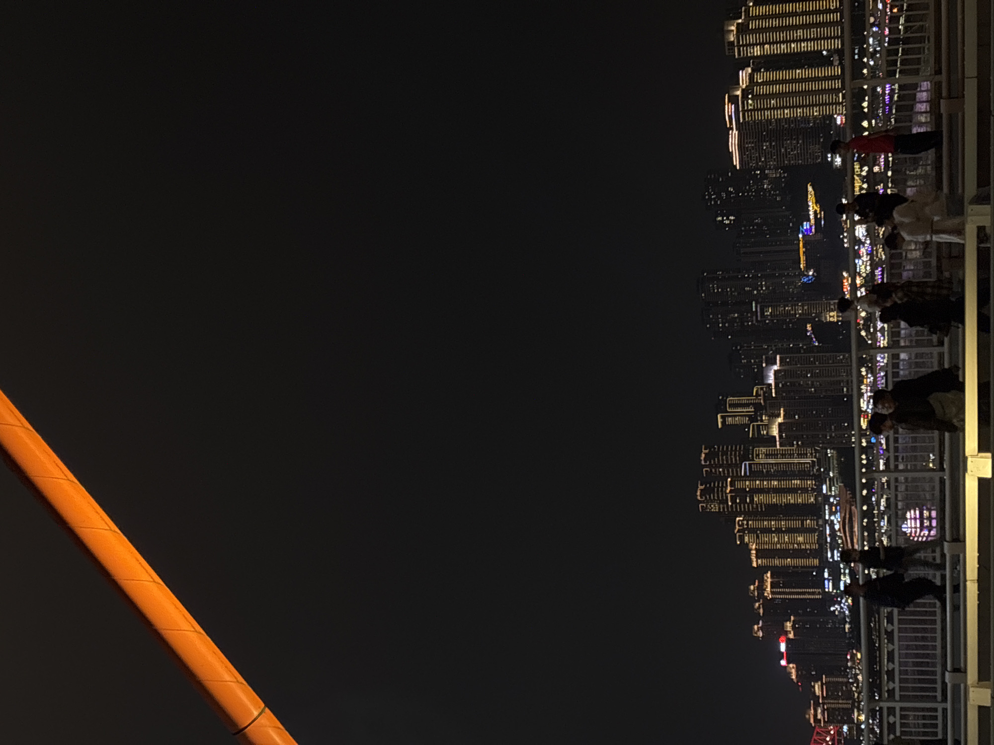 Nighttime cityscape observed from bridge in Yuzhong District