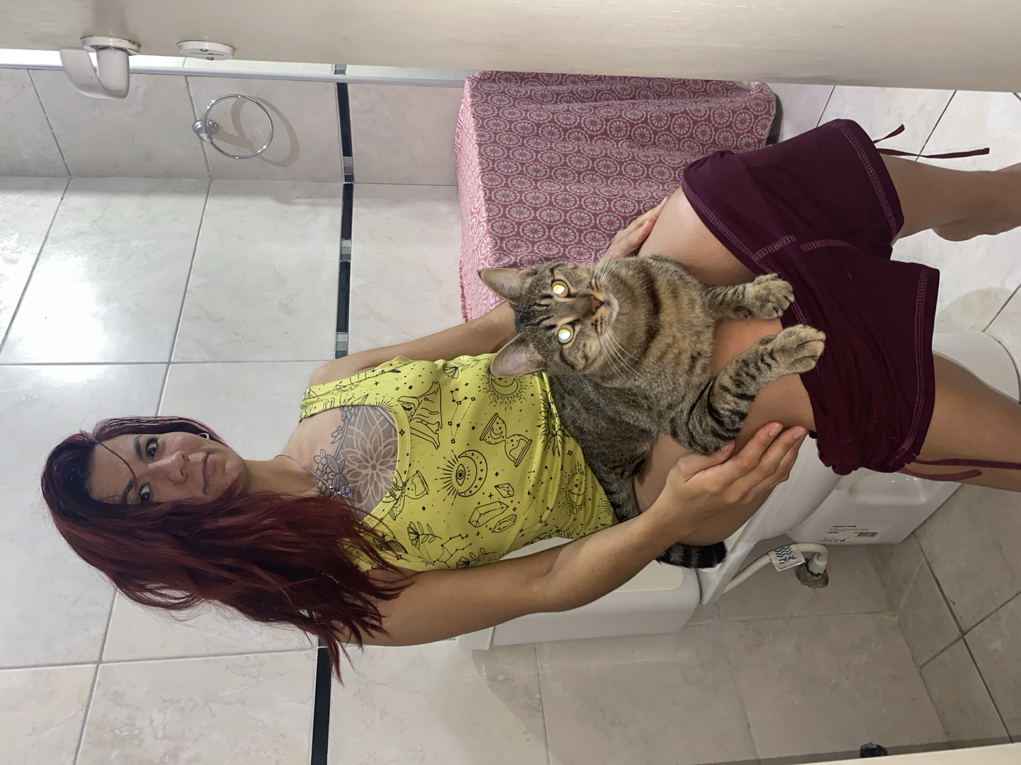 Woman and tabby cat share quiet moments in Wilde home