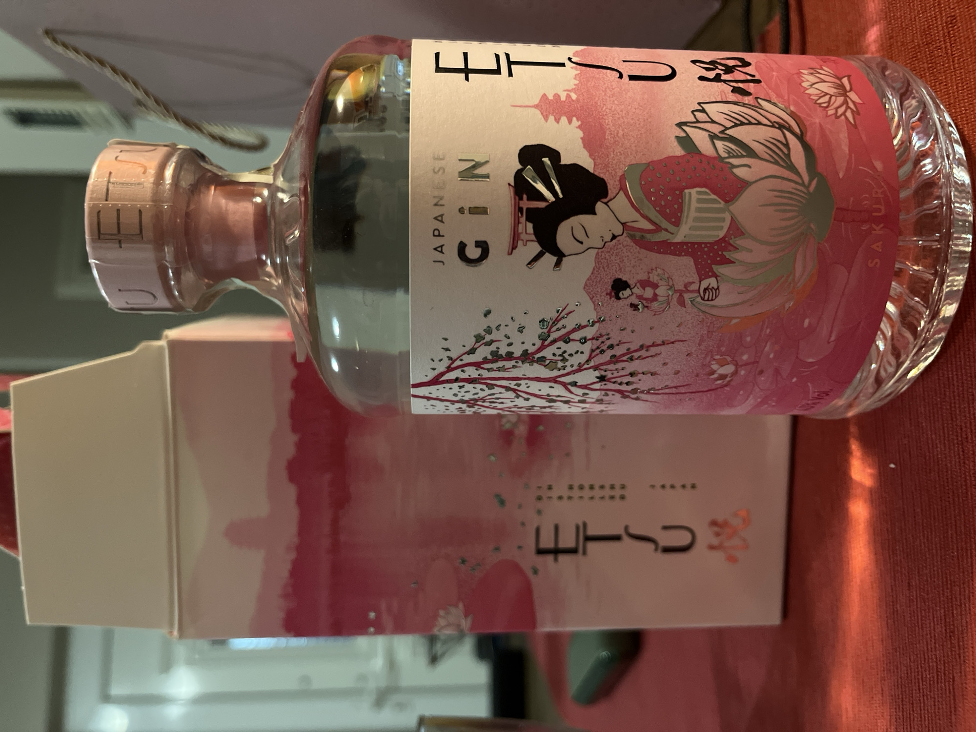 Japanese Gin Bottle Displayed on Red Tablecloth at Golden Beach