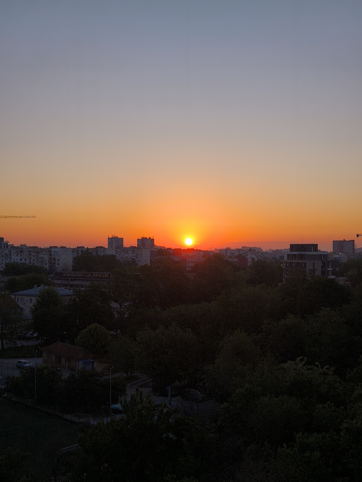 Sunset observed over Plovdiv, Bulgaria with silhouetted trees
