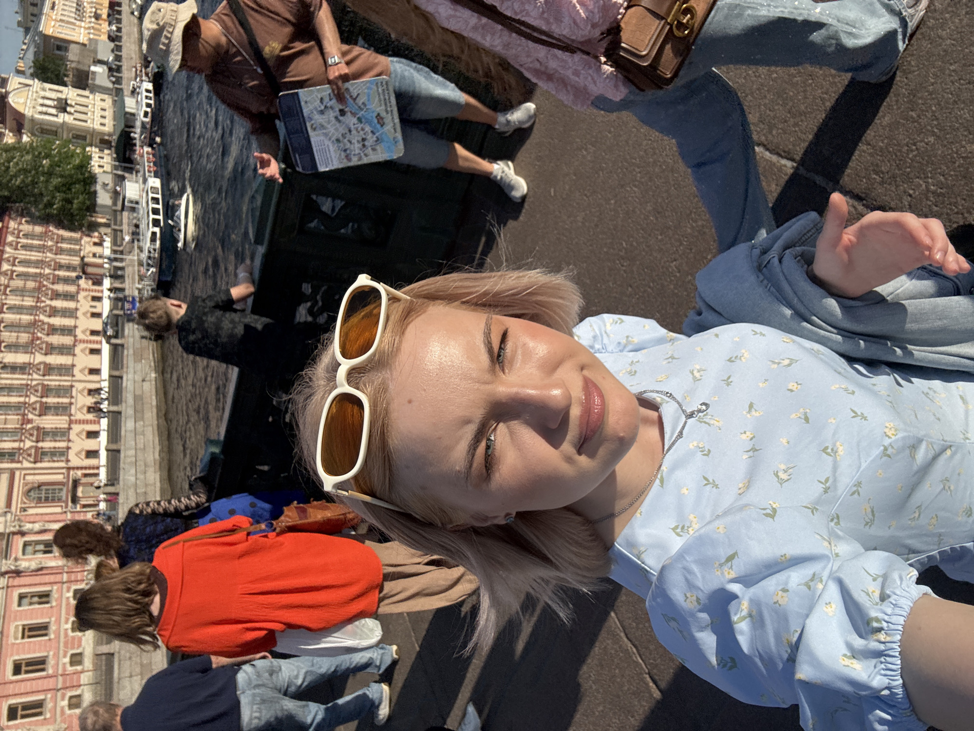 Tourists explore historic Saint Petersburg landmarks on sunny afternoon