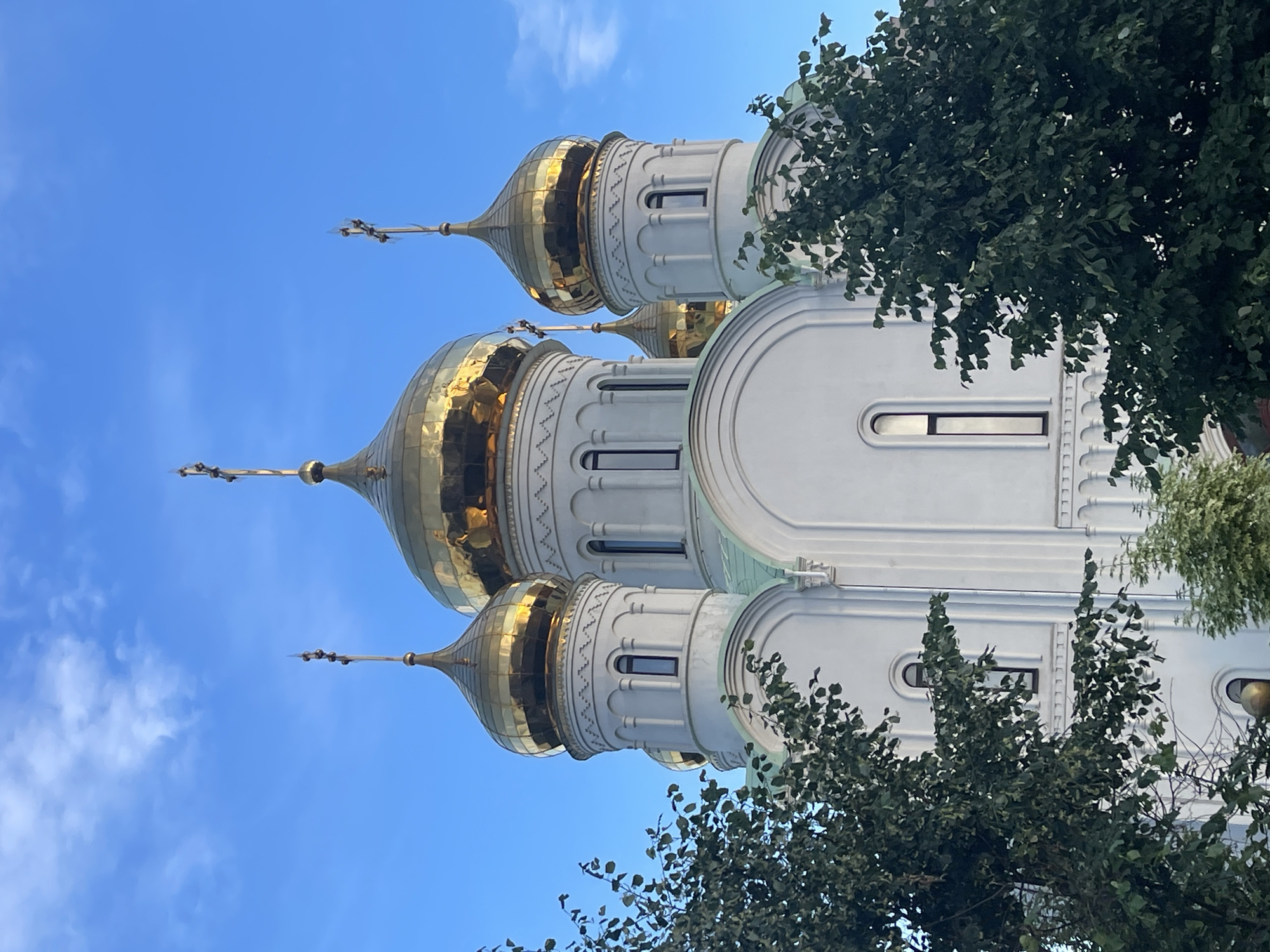 Afternoon stroll past Moscow church and residential high-rises