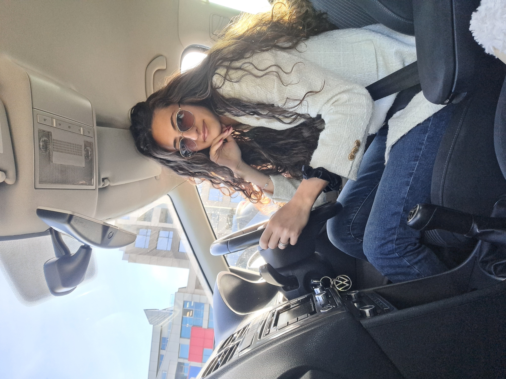 Woman in Volkswagen caught in Sofia morning traffic jam