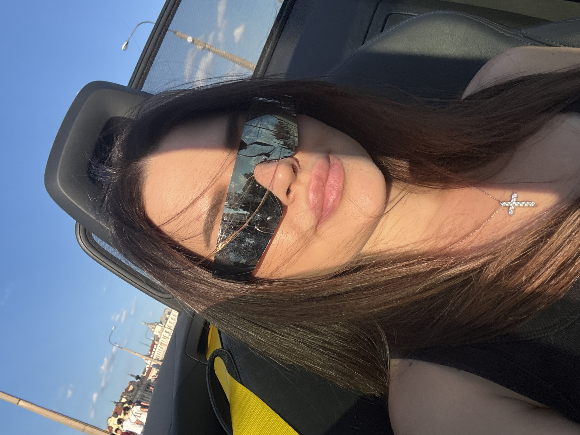 Convertible selfie under blue skies in Prague