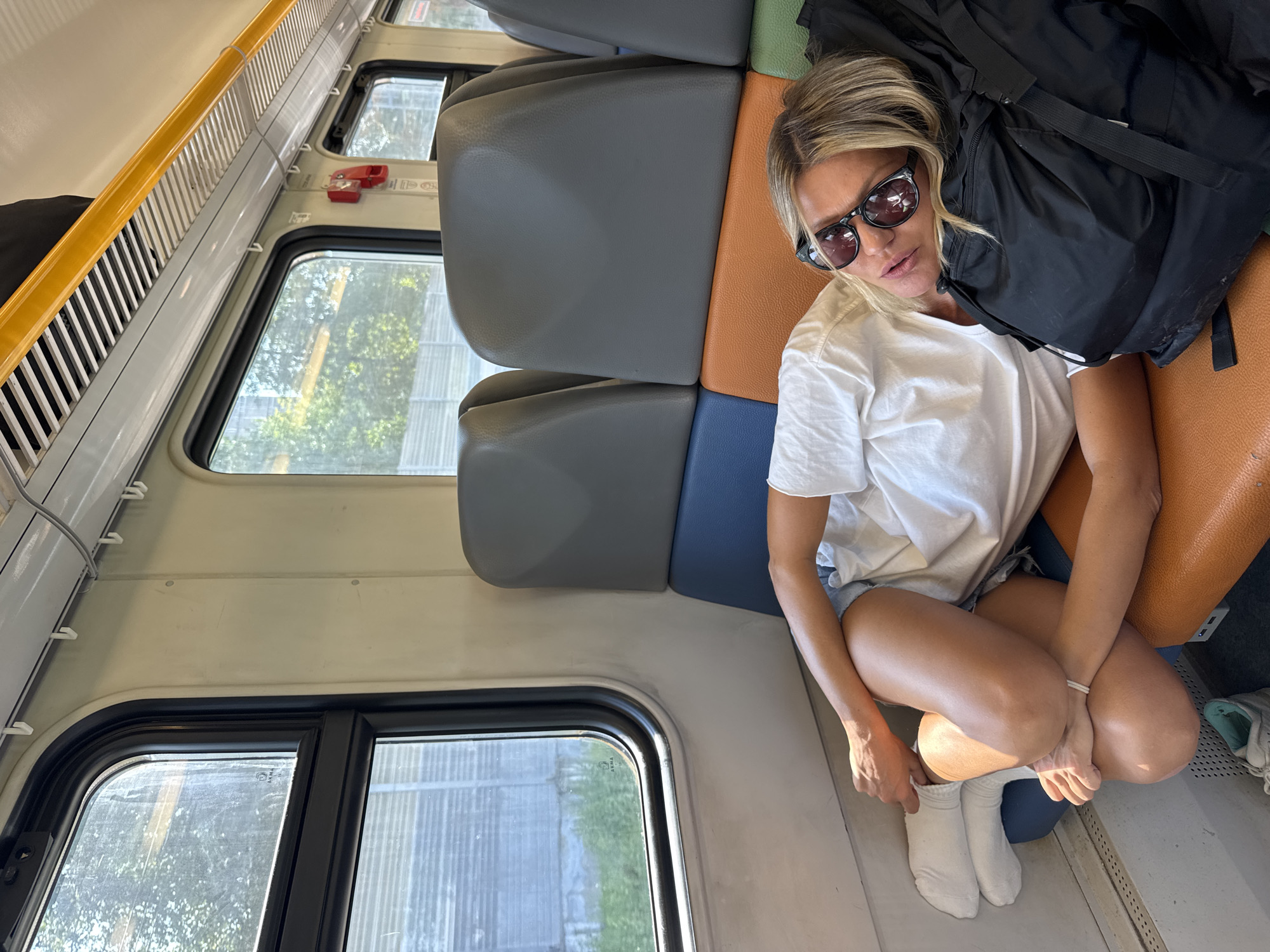 Lazy Sunday stretch across a Moscow train seat