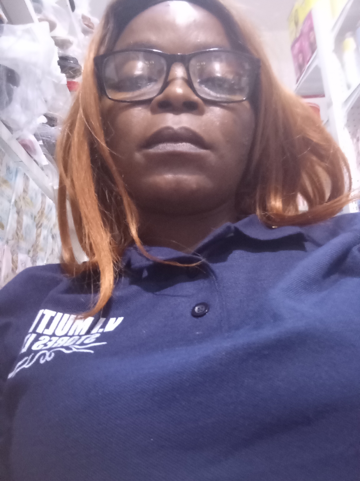 Retail worker selfie series inside a Nigerian store