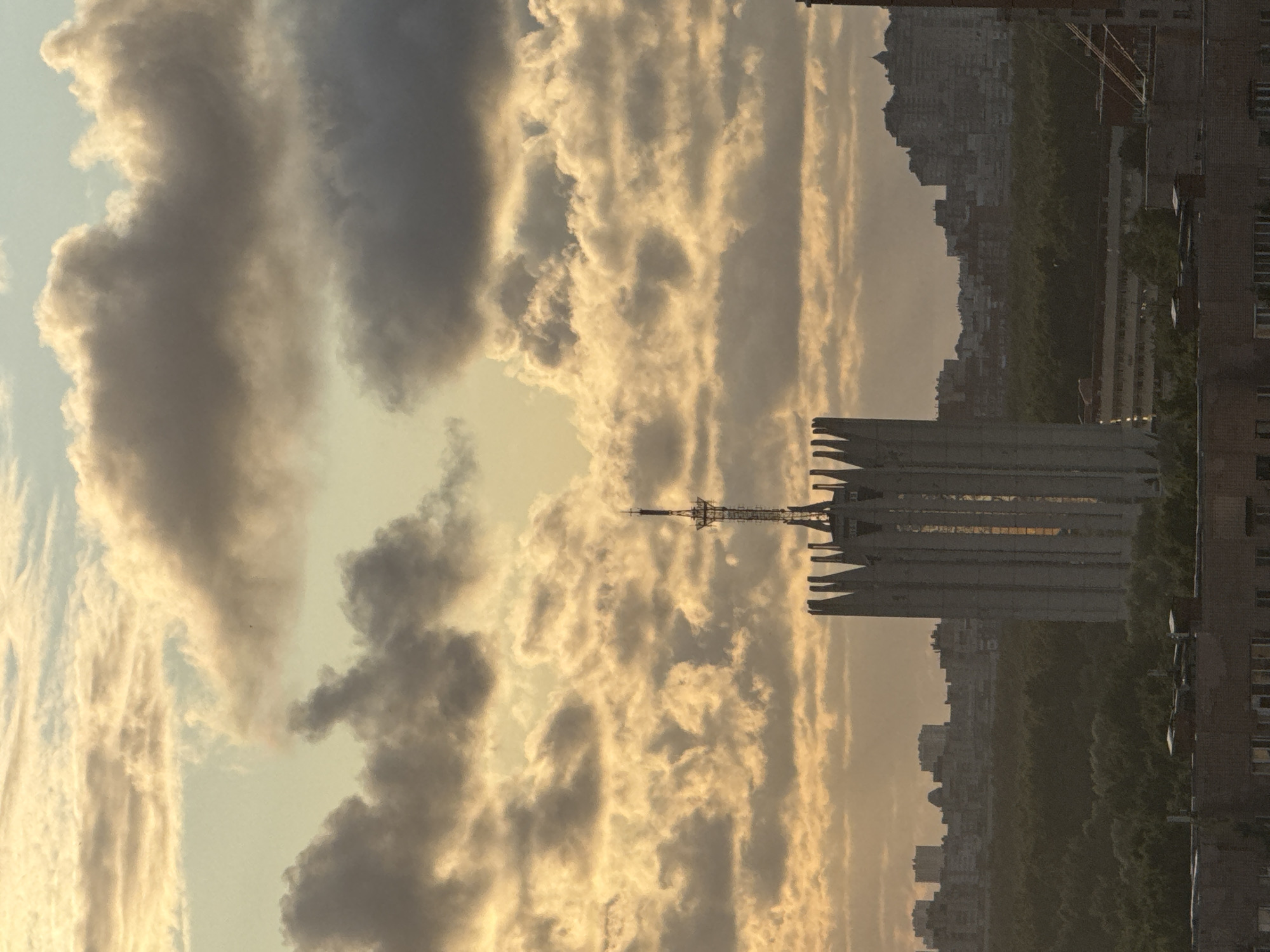 Dramatic sunset clouds over Sinyavino's residential skyline