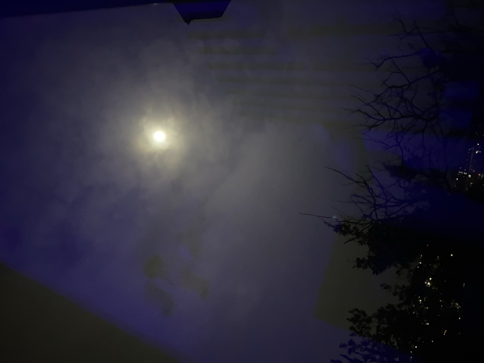 Bright moon illuminates cloudy night sky in Sochi