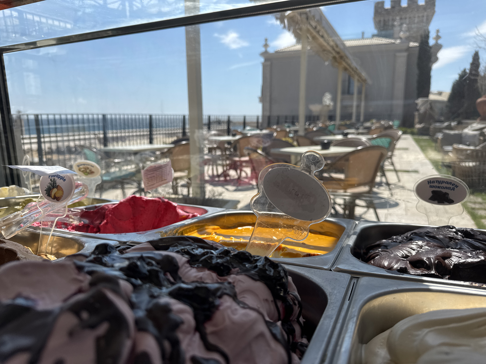Seaside gelato shop and empty cafe terrace documented in Varna