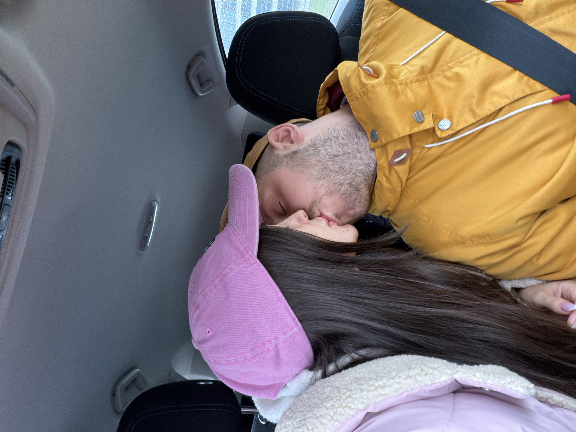 Couple shares intimate moment in car during Saint Petersburg morning