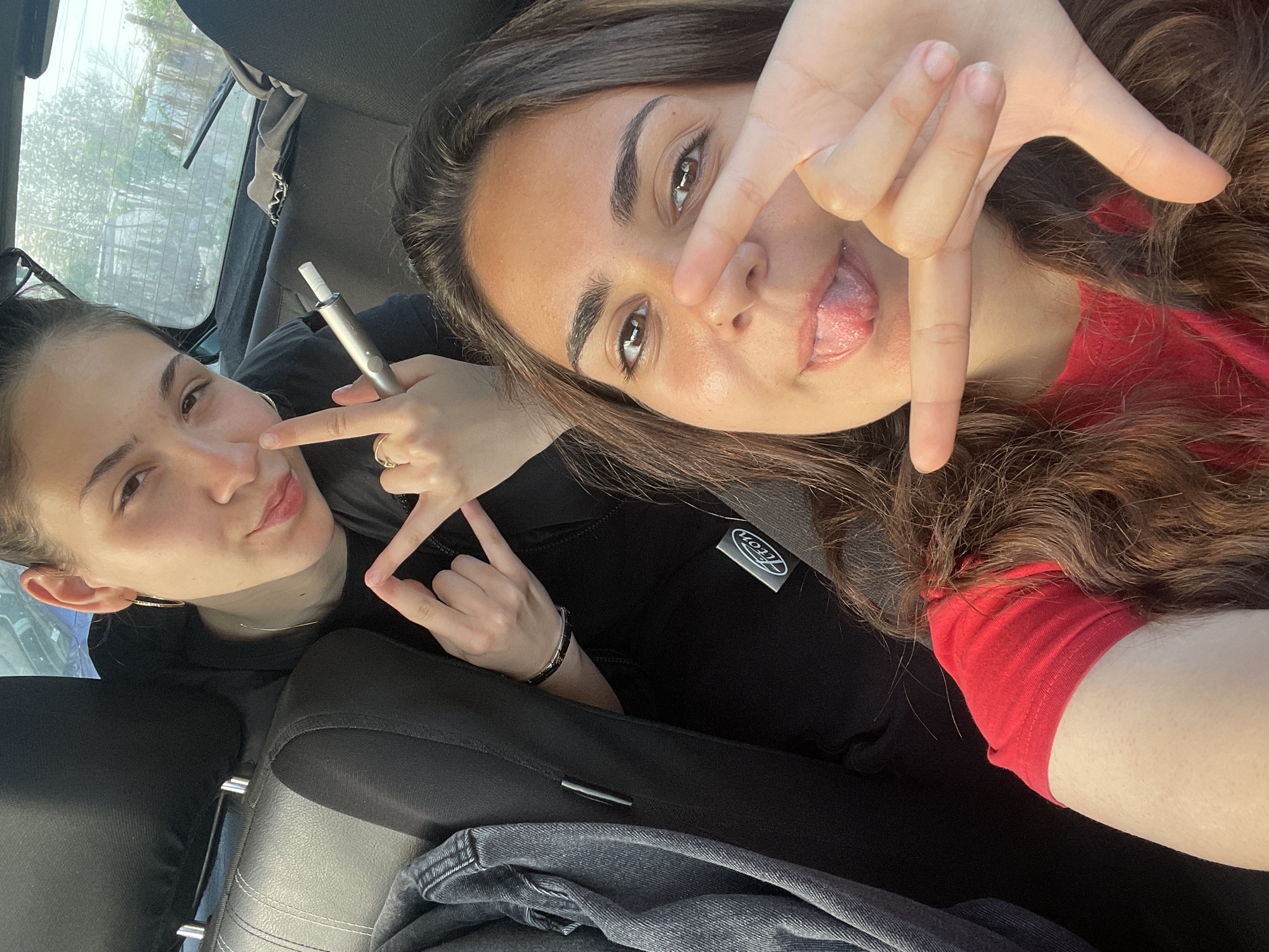 Two women take casual car selfies, multiple angles captured