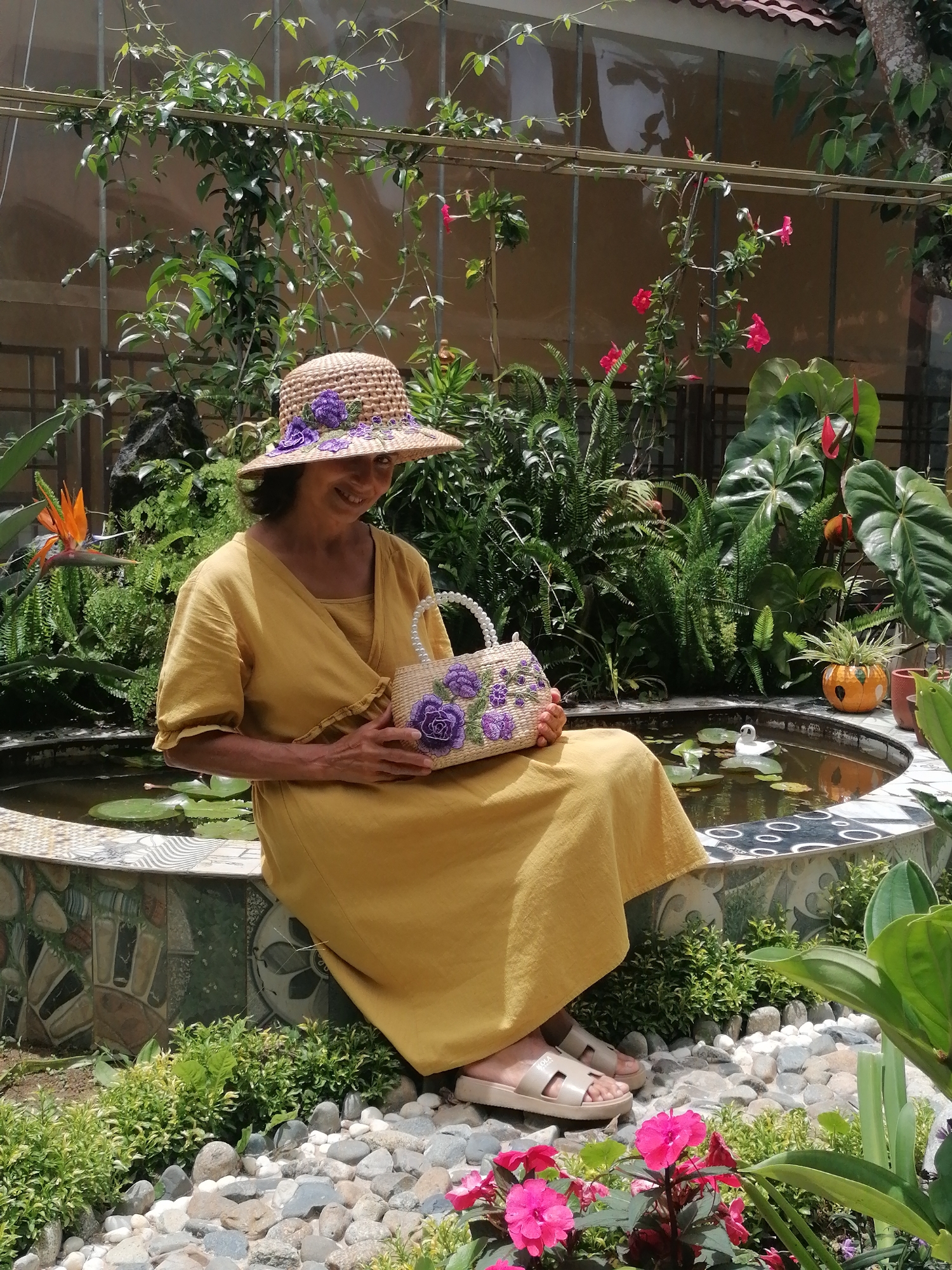 Exploring a Da Lat temple garden with flowers, ponds, and shrines