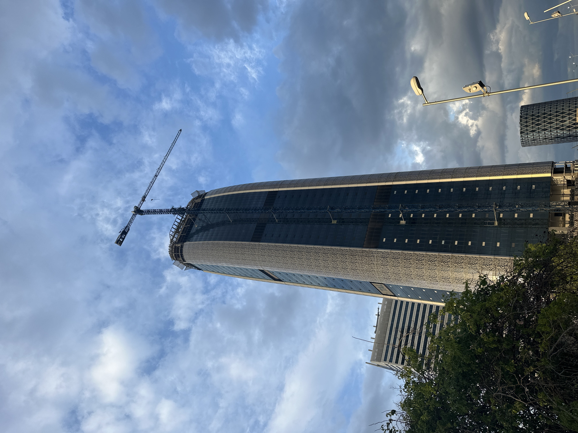 Glass skyscraper construction continues in Sofia with crane visible