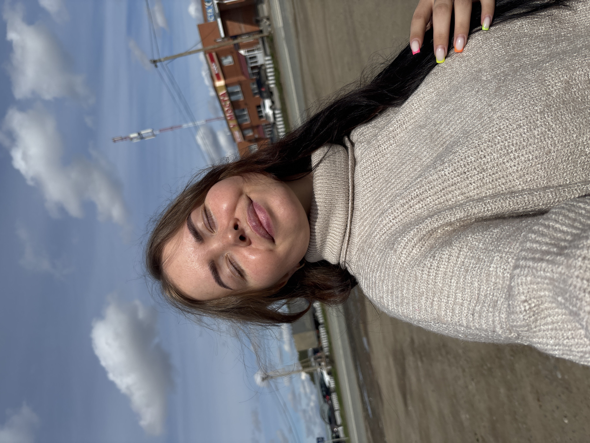 Woman poses for photos on car in rural Russia