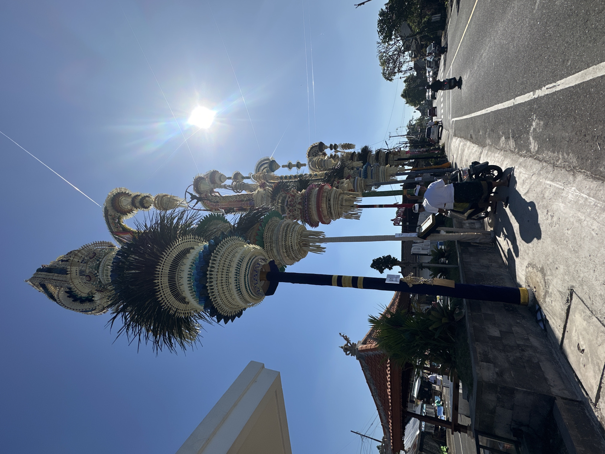 Elaborate penjor line the streets of Mengwi during a Balinese ceremony
