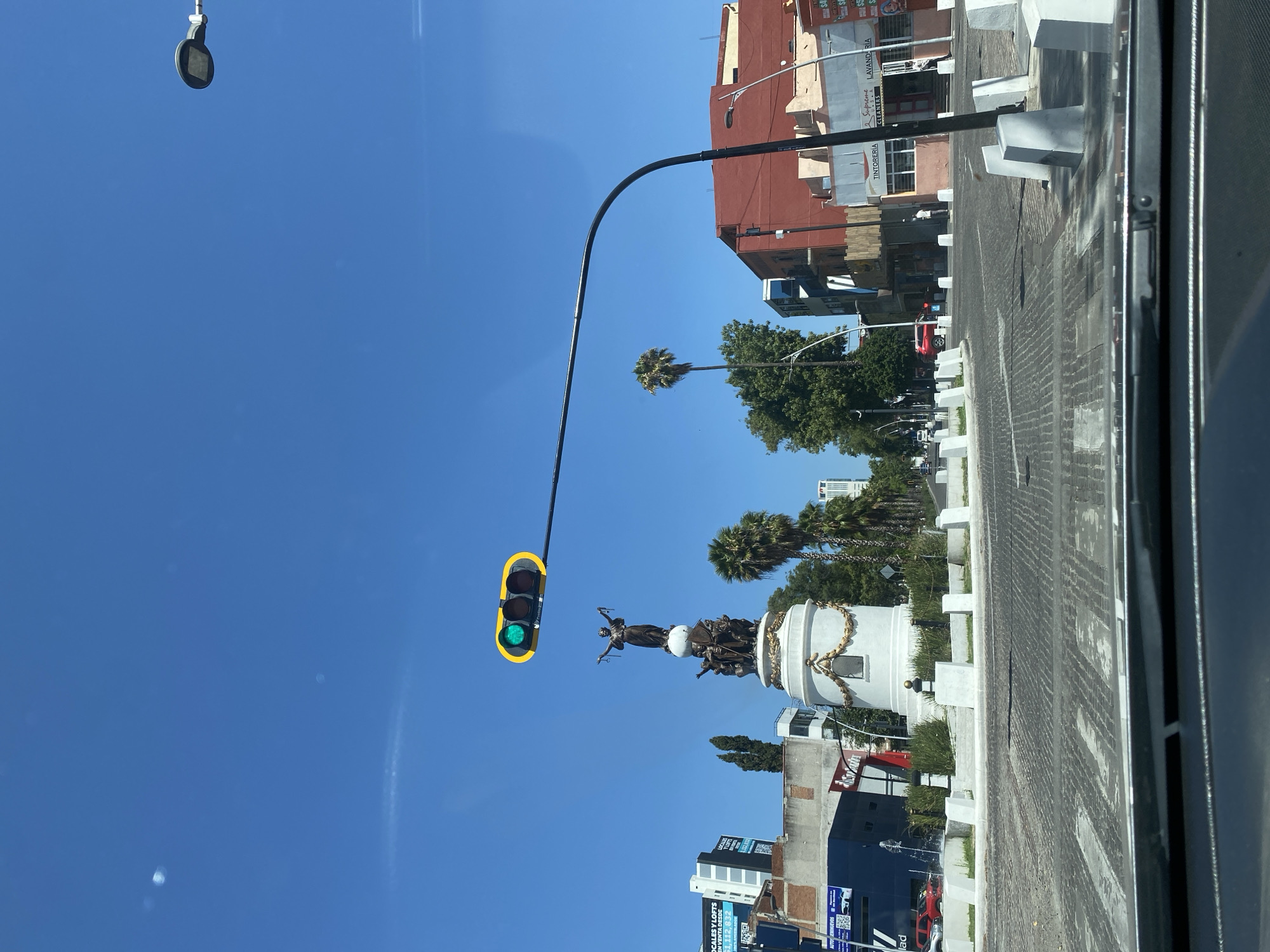 Puebla scenes: street monument and classroom captured same afternoon