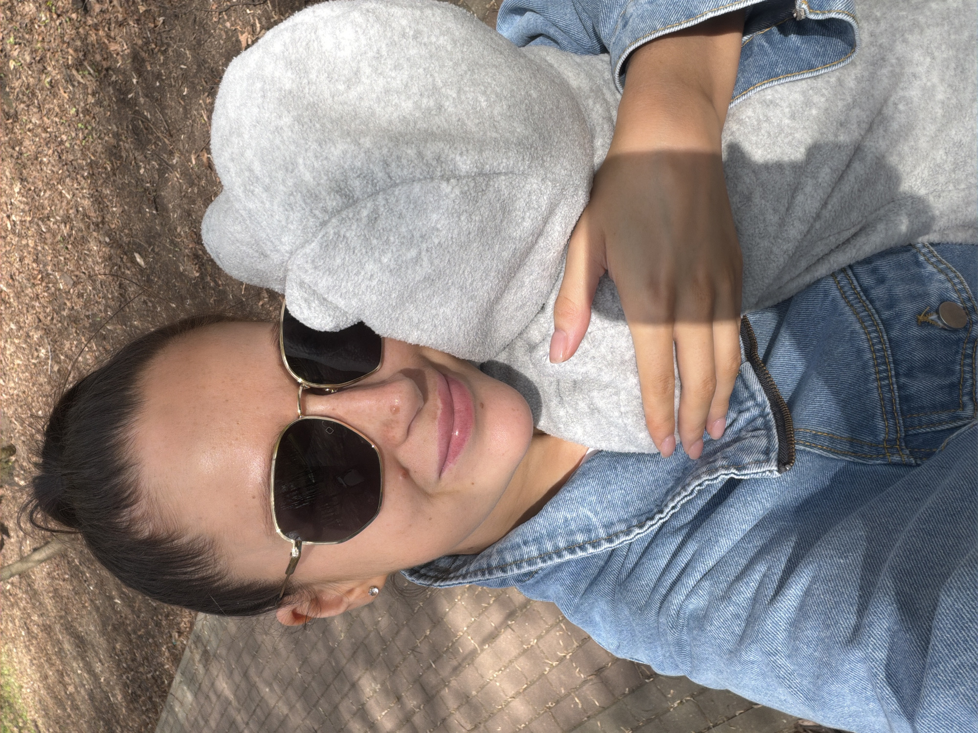 Woman with baby photographed on brick path in Khimki