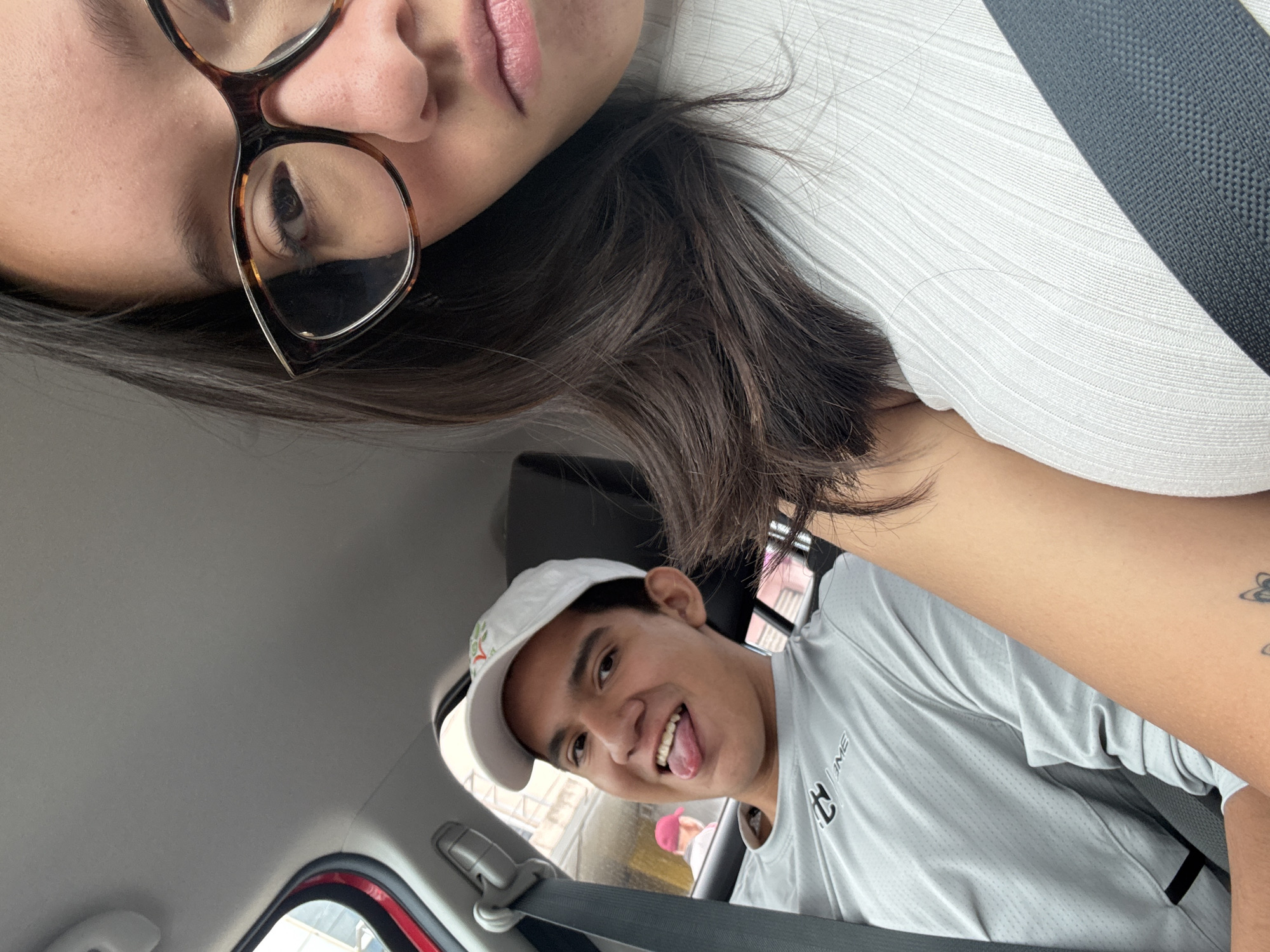 Young couple takes car selfie in Puebla, Mexico