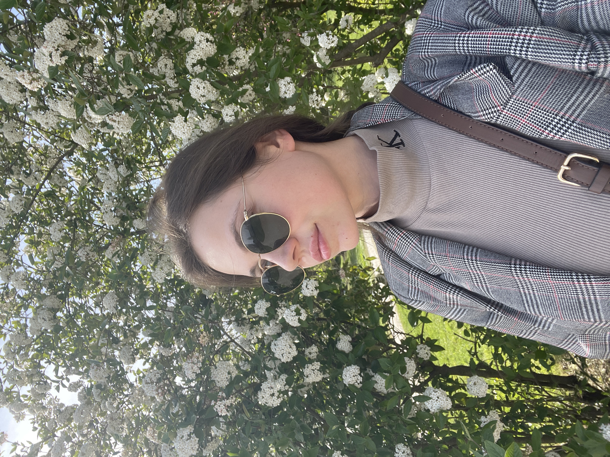 Woman enjoys spring photo session in blooming Ljubljana park