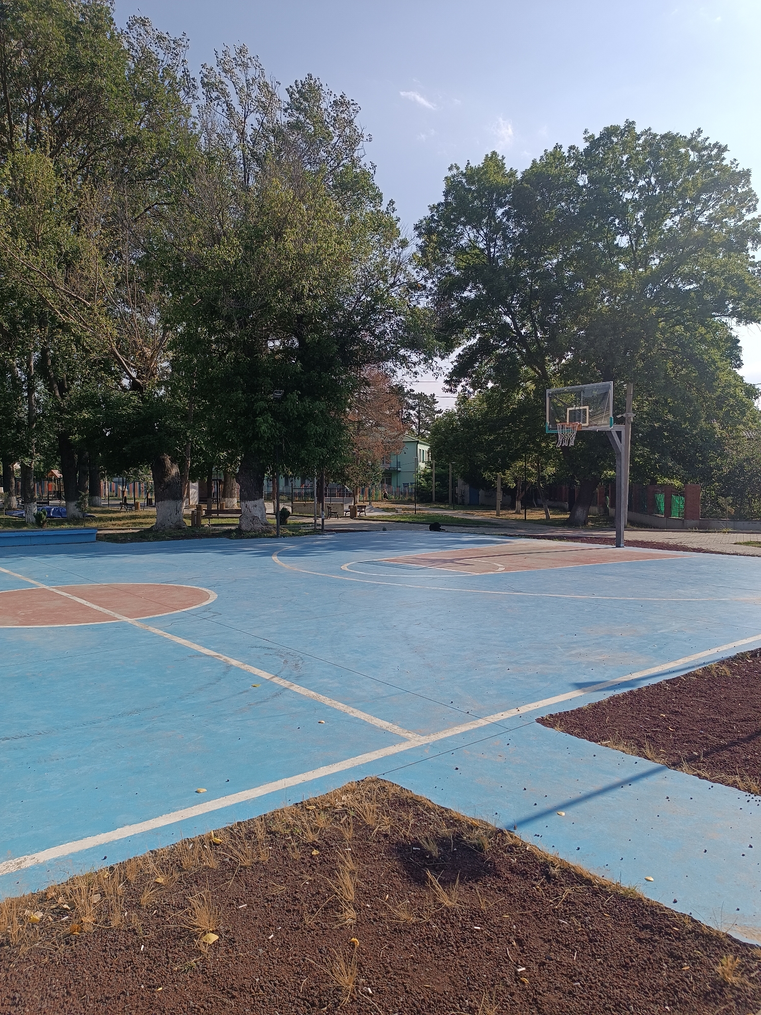Basketball and park life on a summer morning in Khashuri