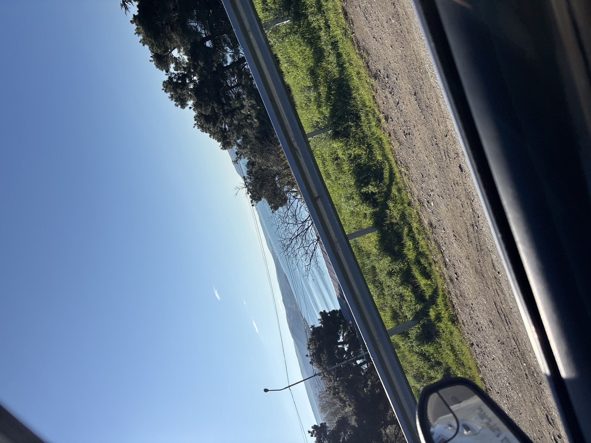 Woman takes car selfies by lake in Tbilisi