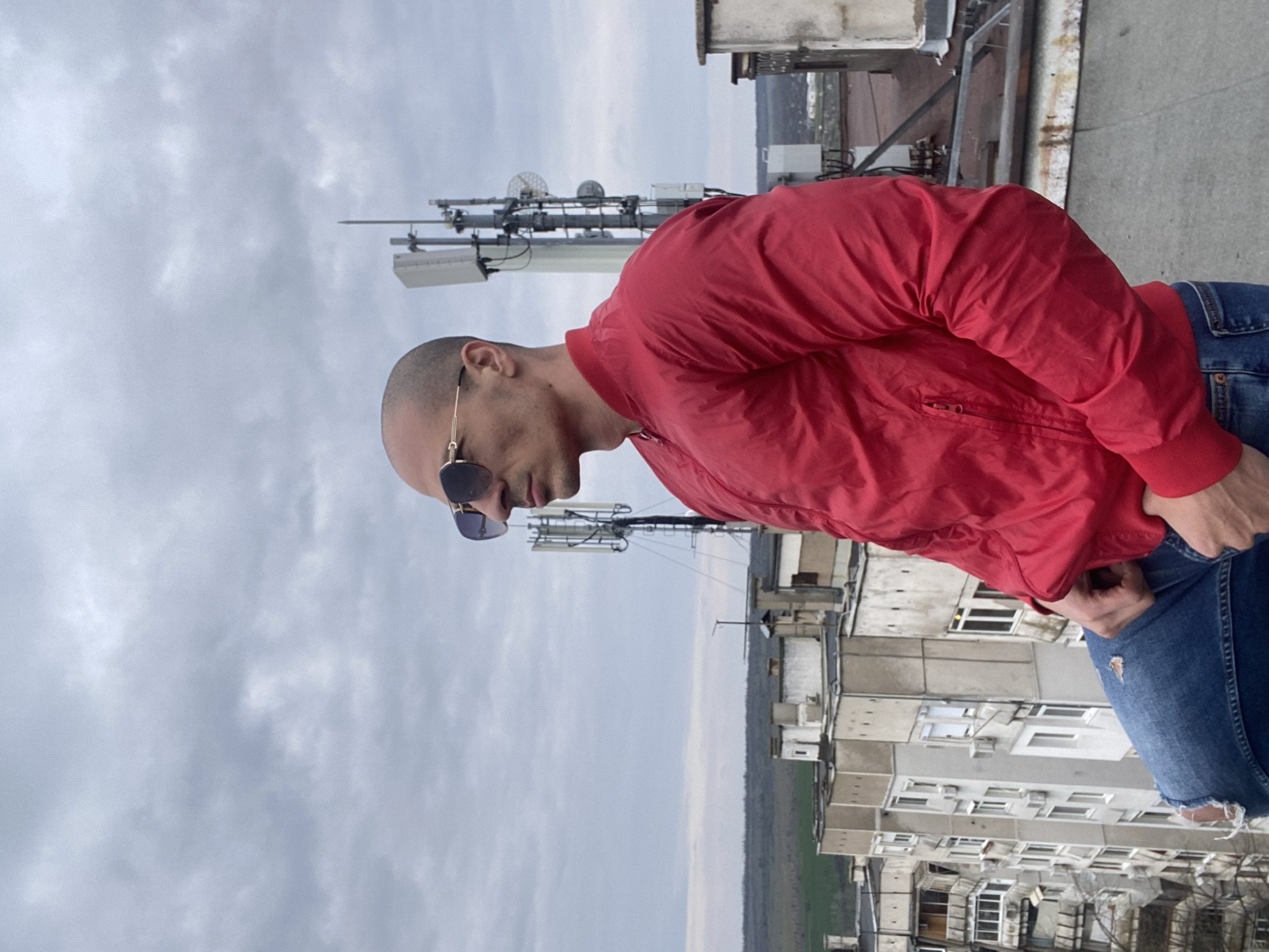 Tattooed man and dog photographed across Pleven rooftops