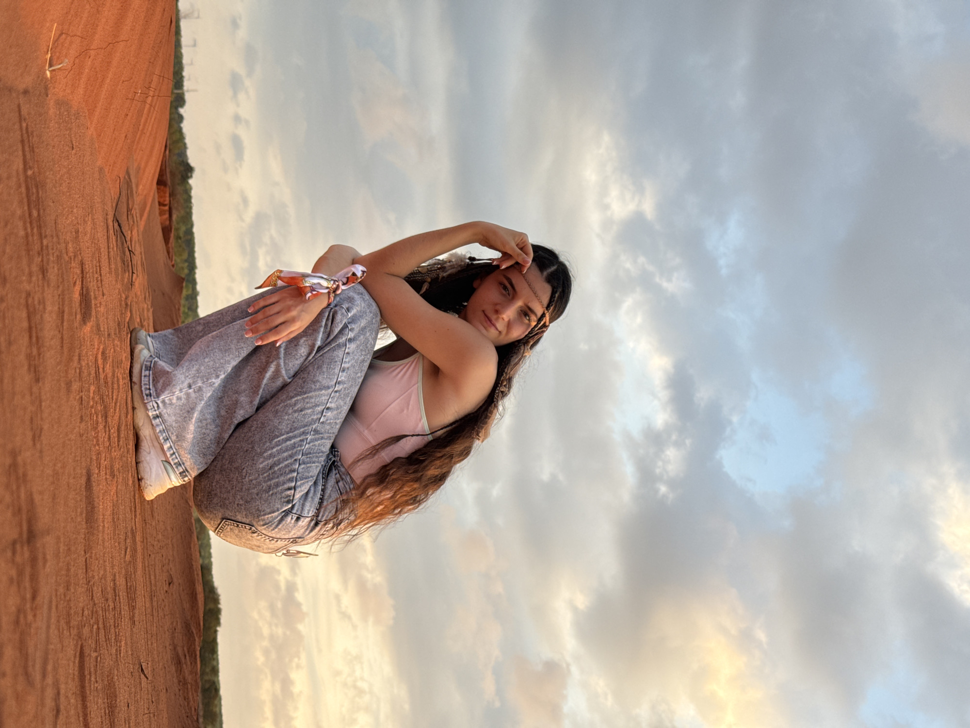 Tourist photographed at Mũi Né sand dunes during golden hour