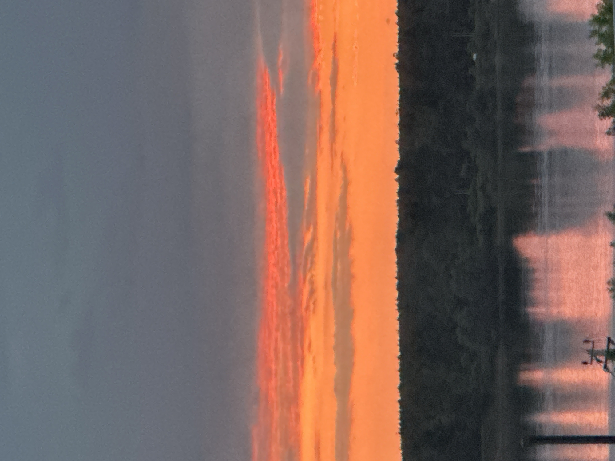 Dramatic sunset illuminates Chaikovsky, Russia over Kama River