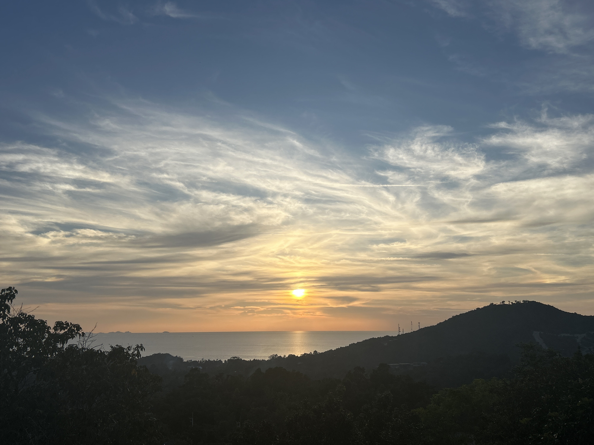 Sunset documented over calm seas in Koh Phangan, Thailand