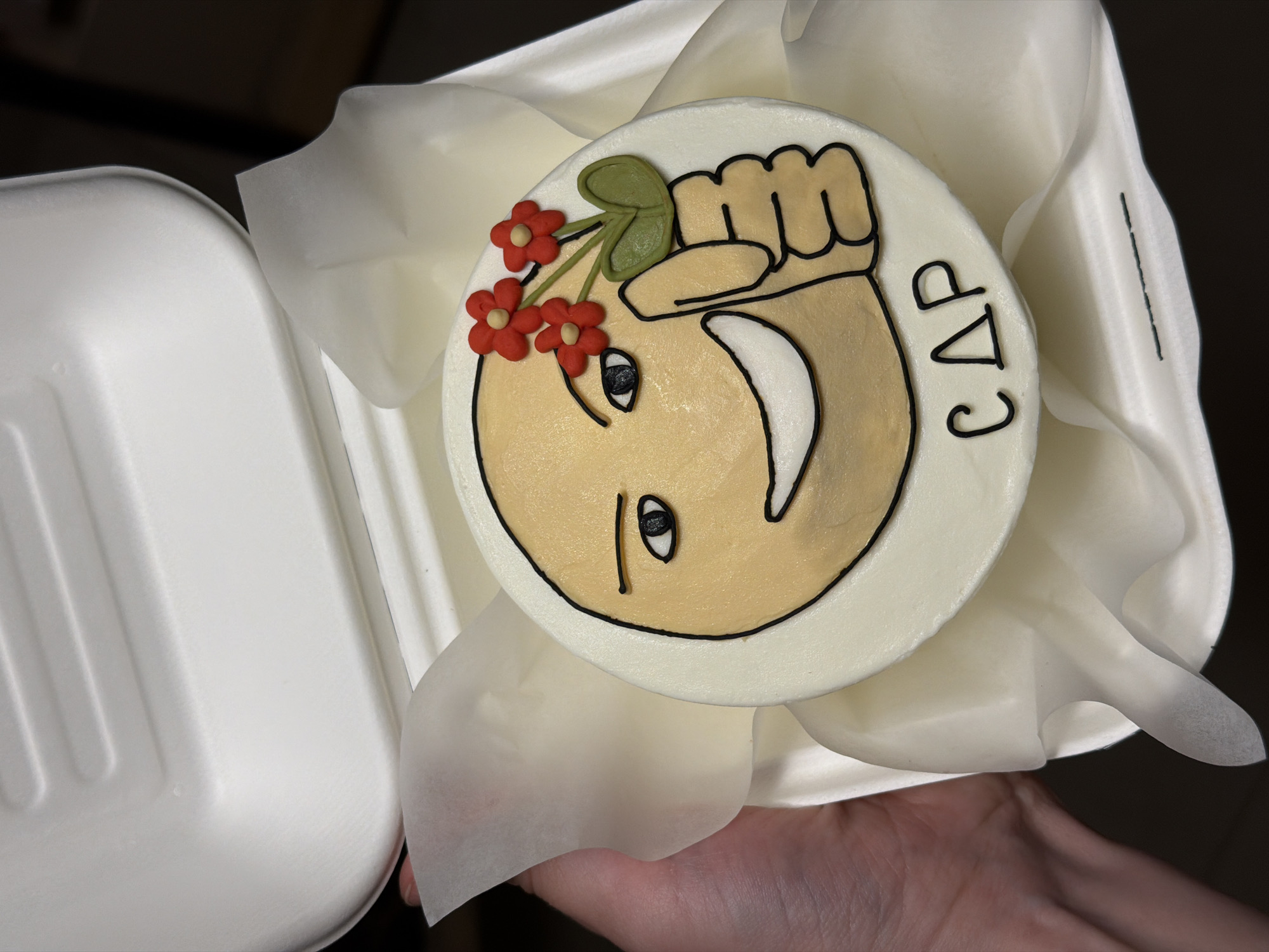 Custom emoji cake spotted in Tel Aviv takeout container