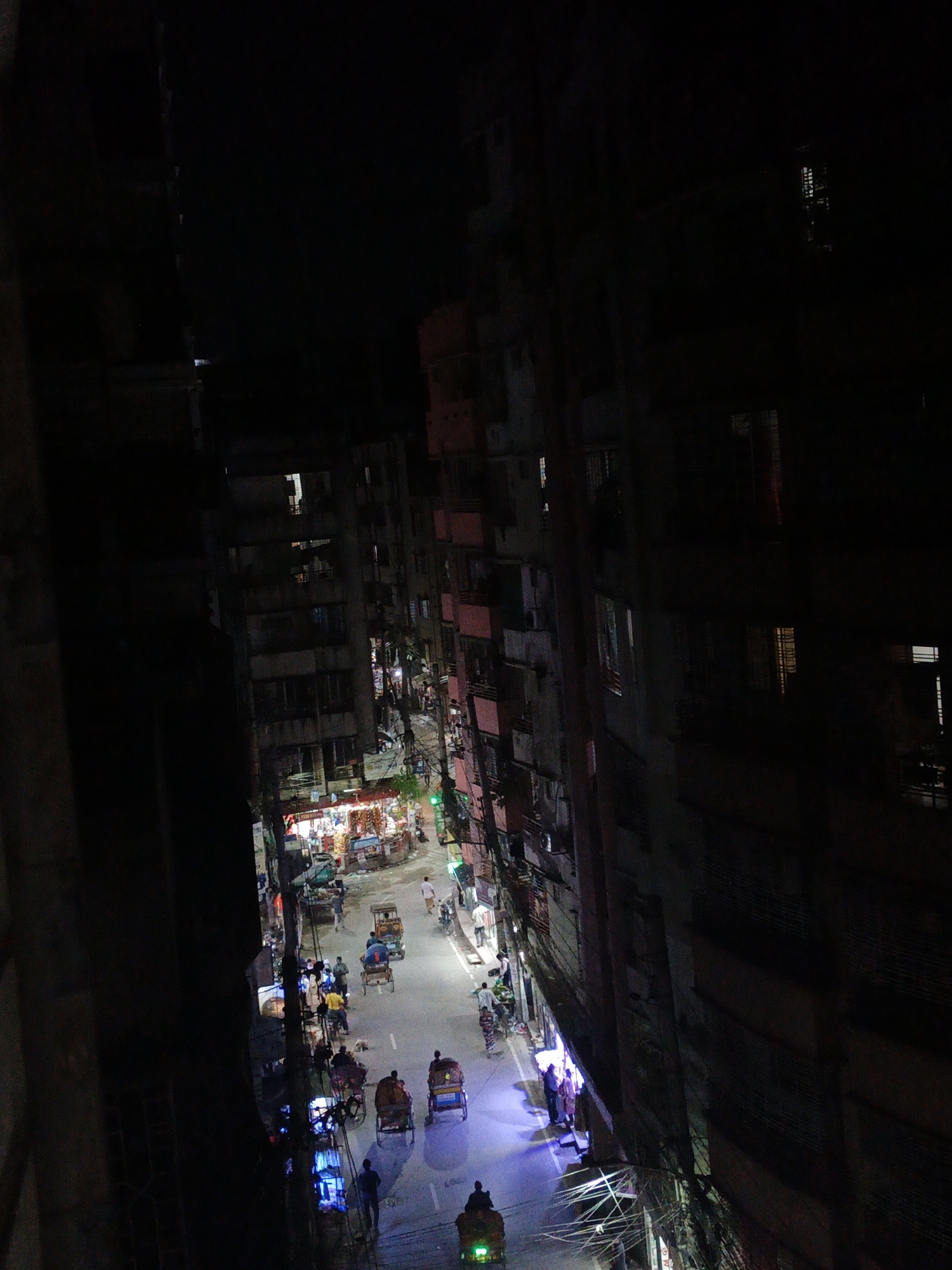 Nighttime urban street activity captured from elevated perspectives