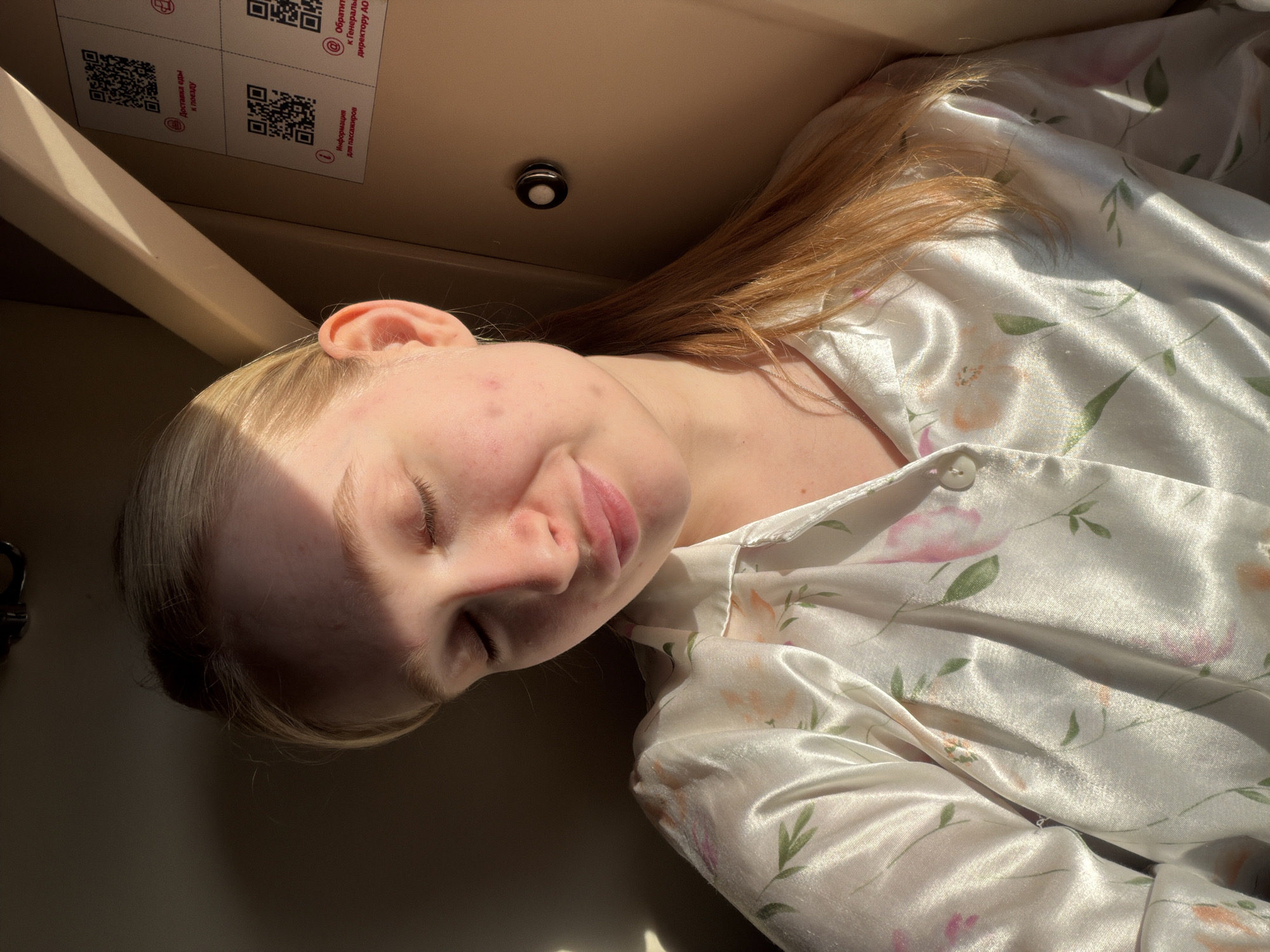 Person observed resting in train compartment in Krasnyy Sulin