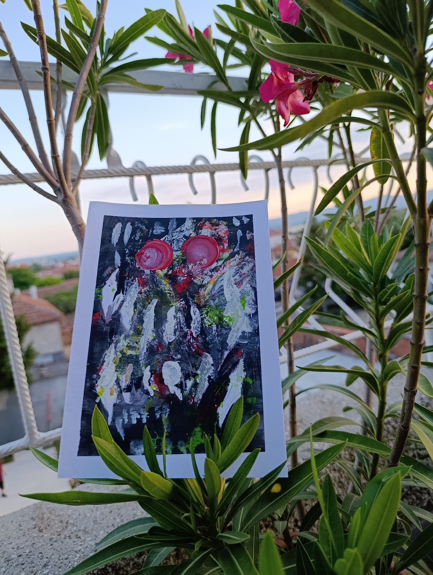 Artist creates paintings on Svilengrad balcony during golden hour