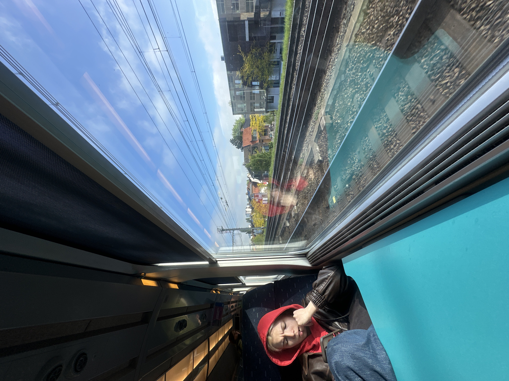 Train passenger rests during morning commute in Antwerp