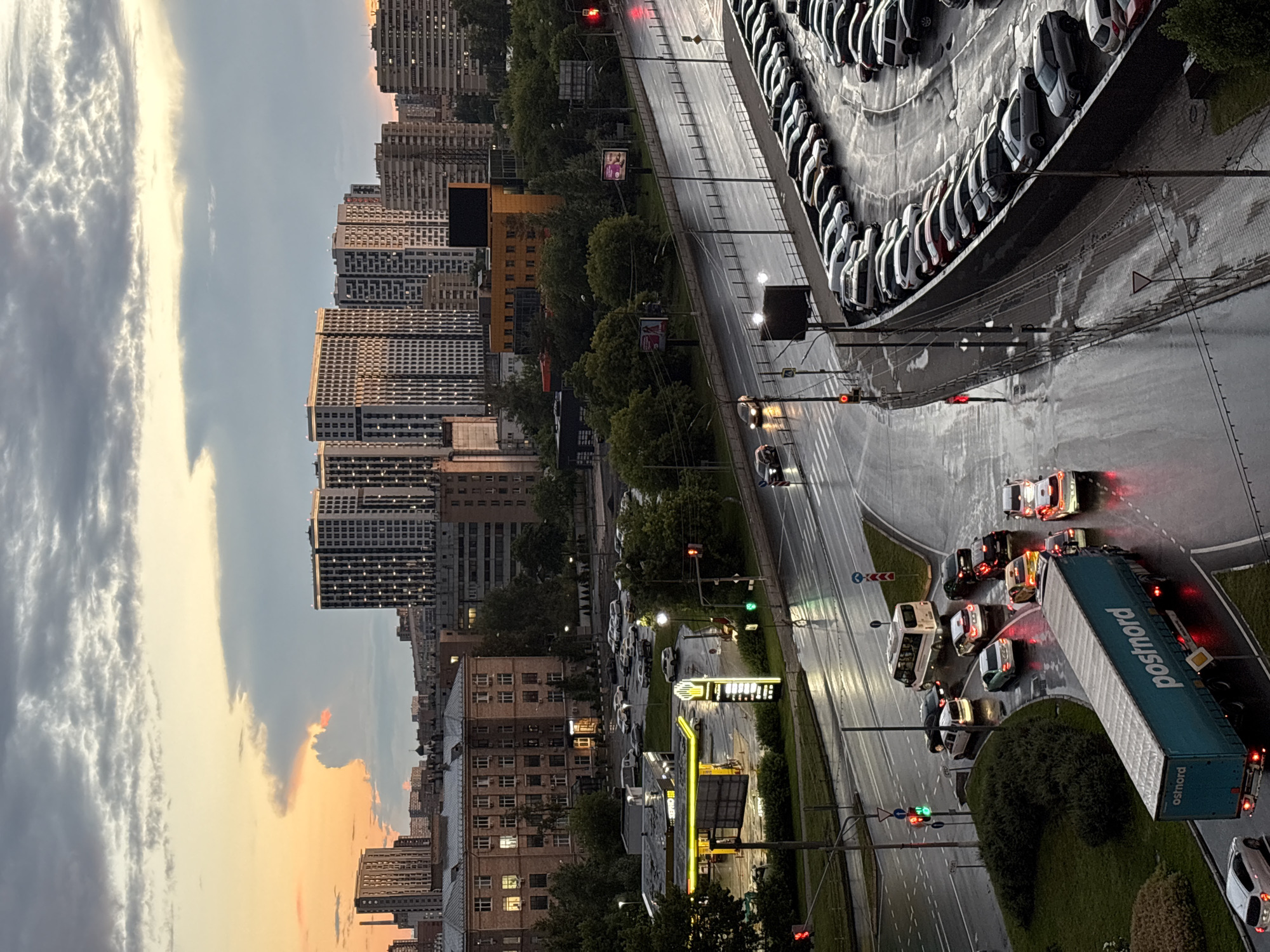 Wet roads and a striking sunset over Mytishchi traffic