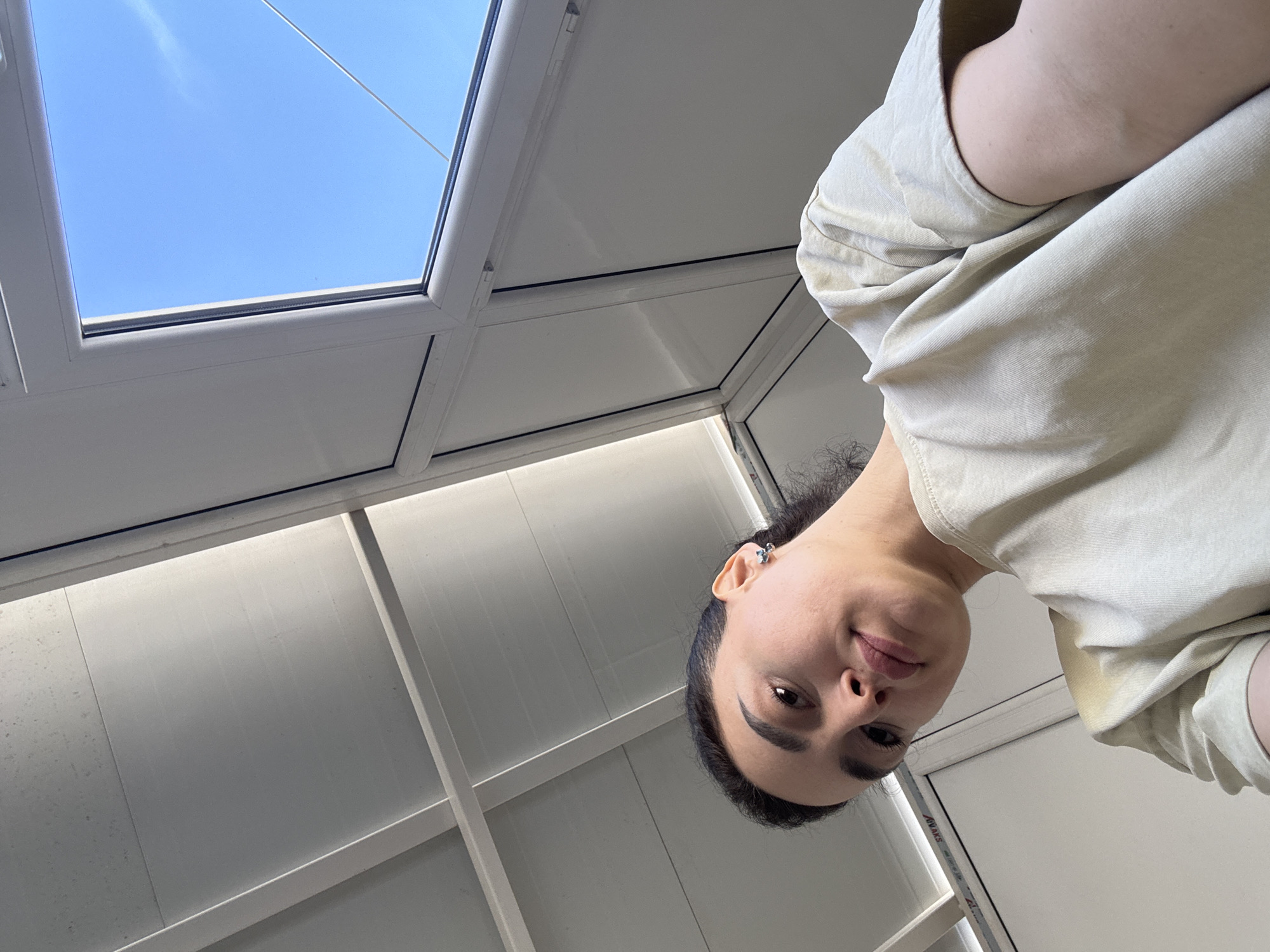 Woman documents morning routine across Tbilisi apartment in selfie series