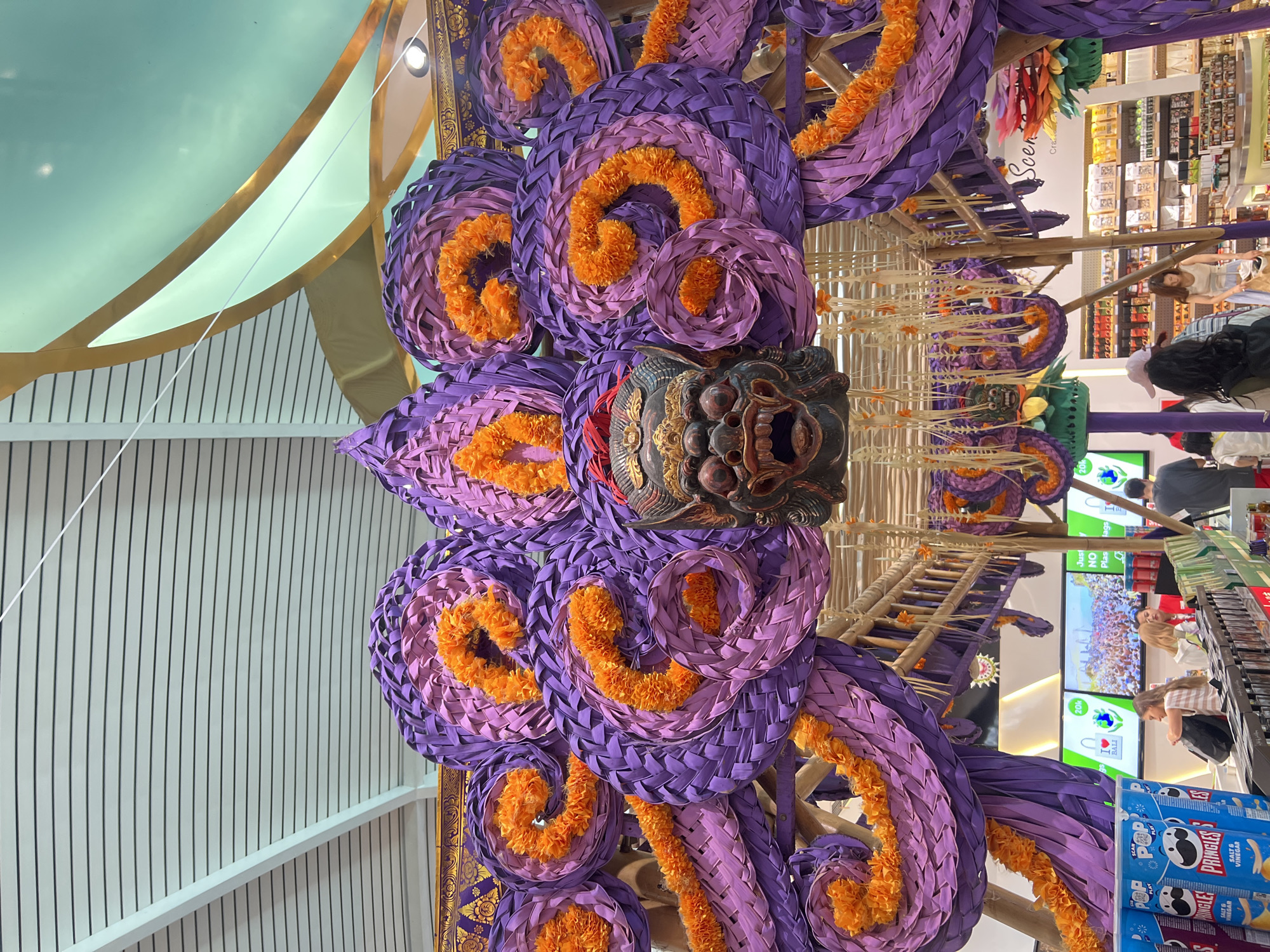 Bali airport departure area decked in vivid Balinese decor