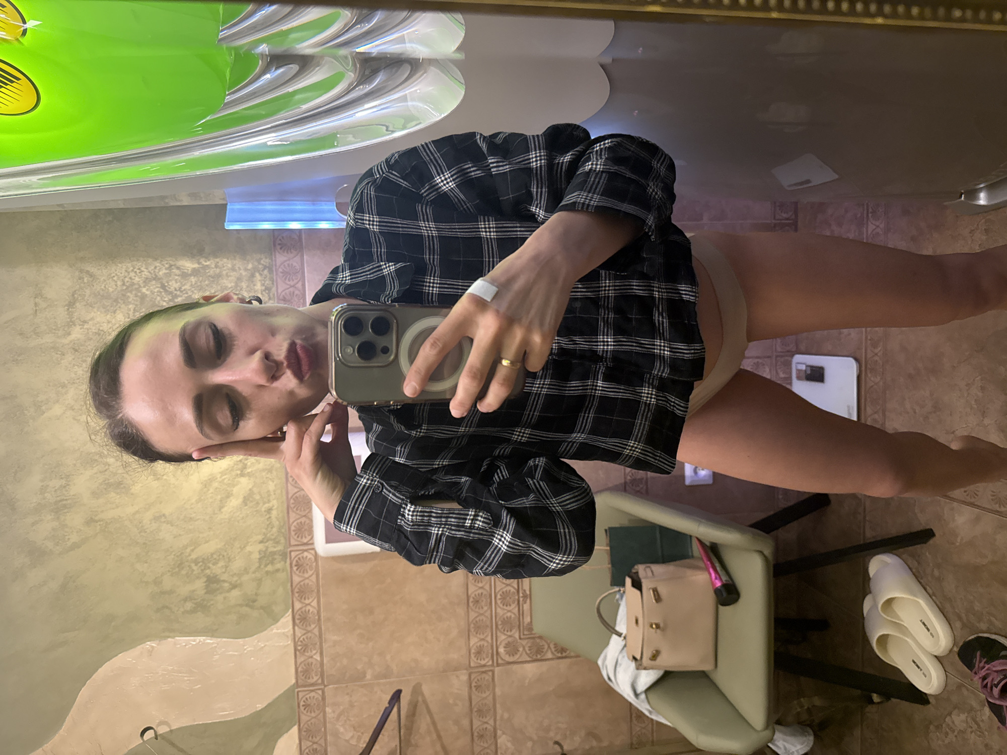 Woman takes mirror selfies in Saint Petersburg changing room