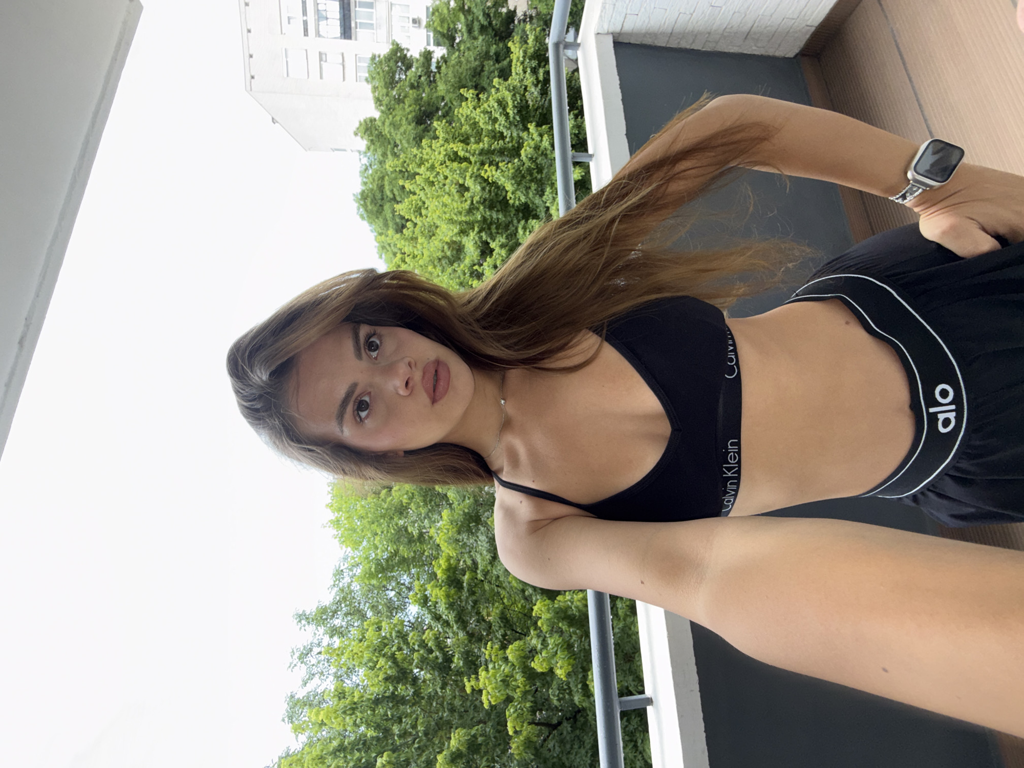 Woman captures morning selfie session indoors and outdoors