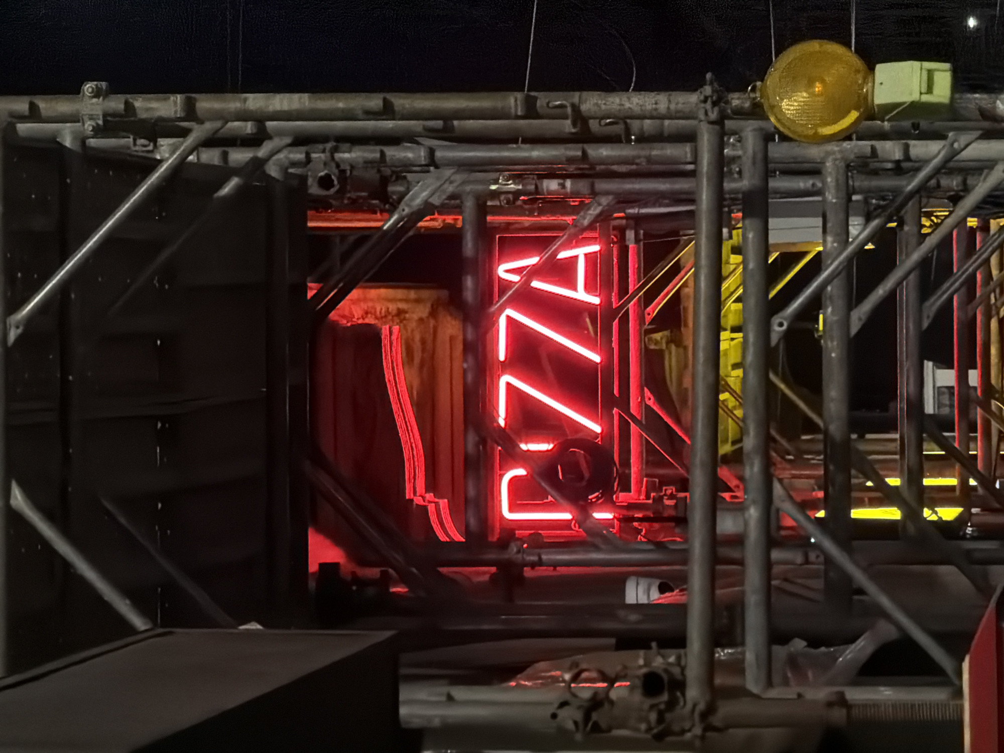 Neon signs and movie billboards light up a Milan night
