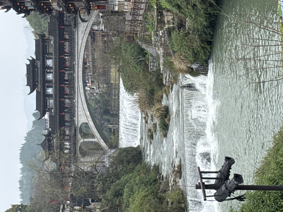 Morning tour captures Furong Ancient Town's waterfall and traditional life