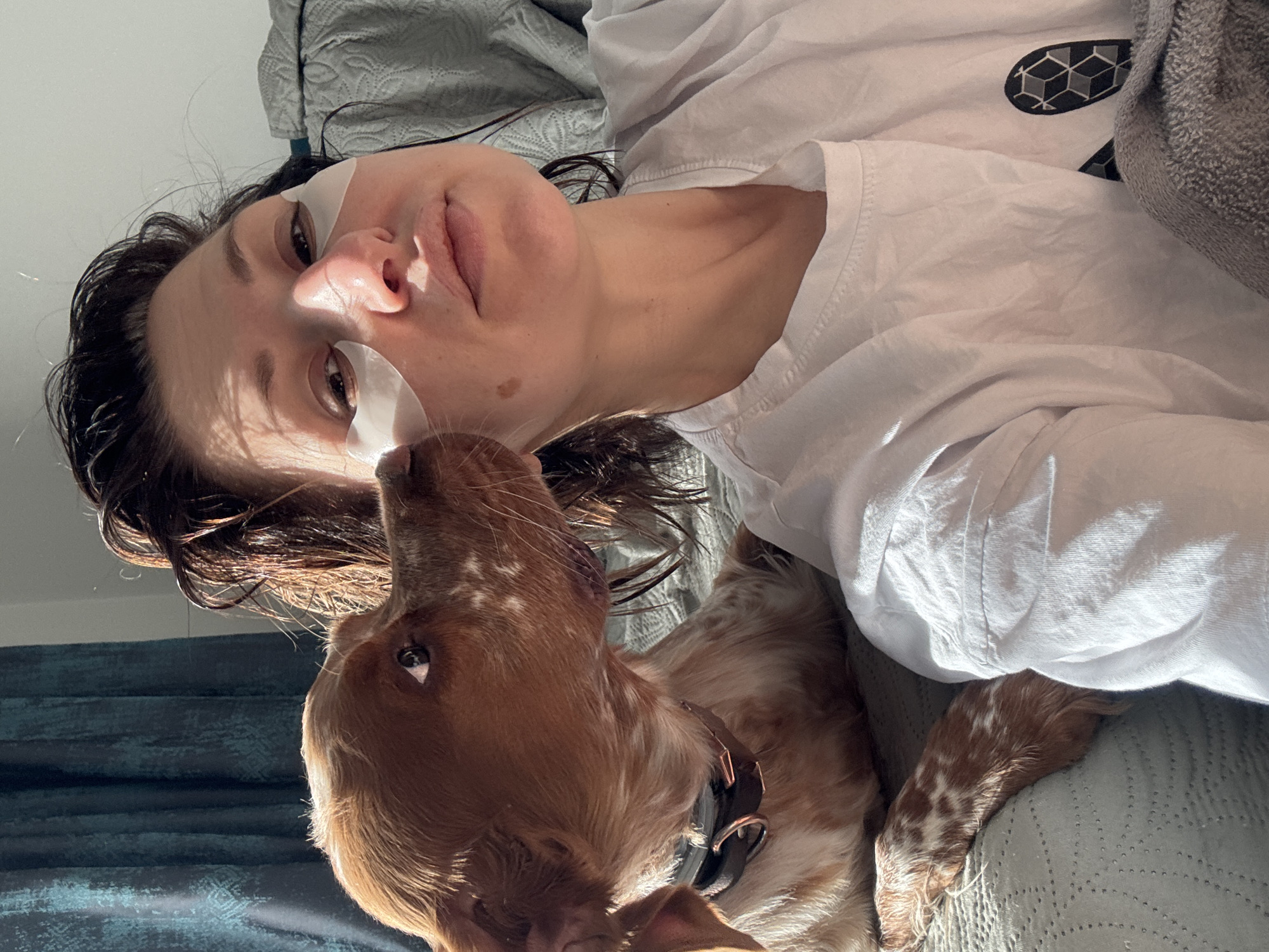 Woman enjoys morning skincare routine with dog companion in Sofia