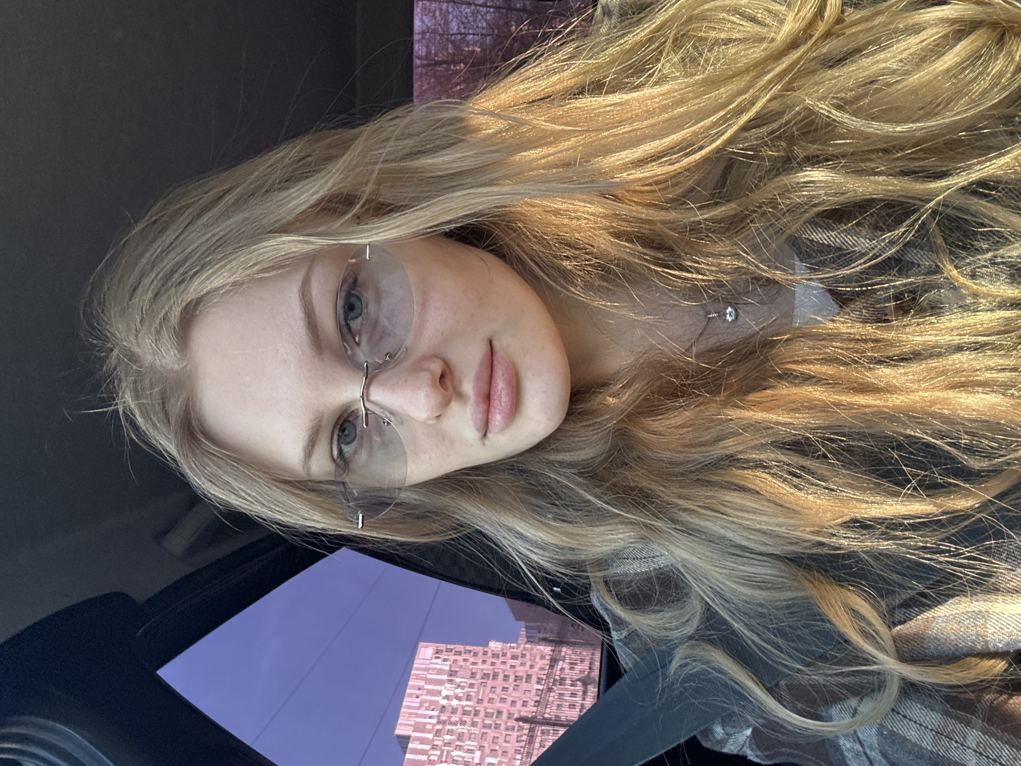 Woman takes car selfies in Perm, Russia