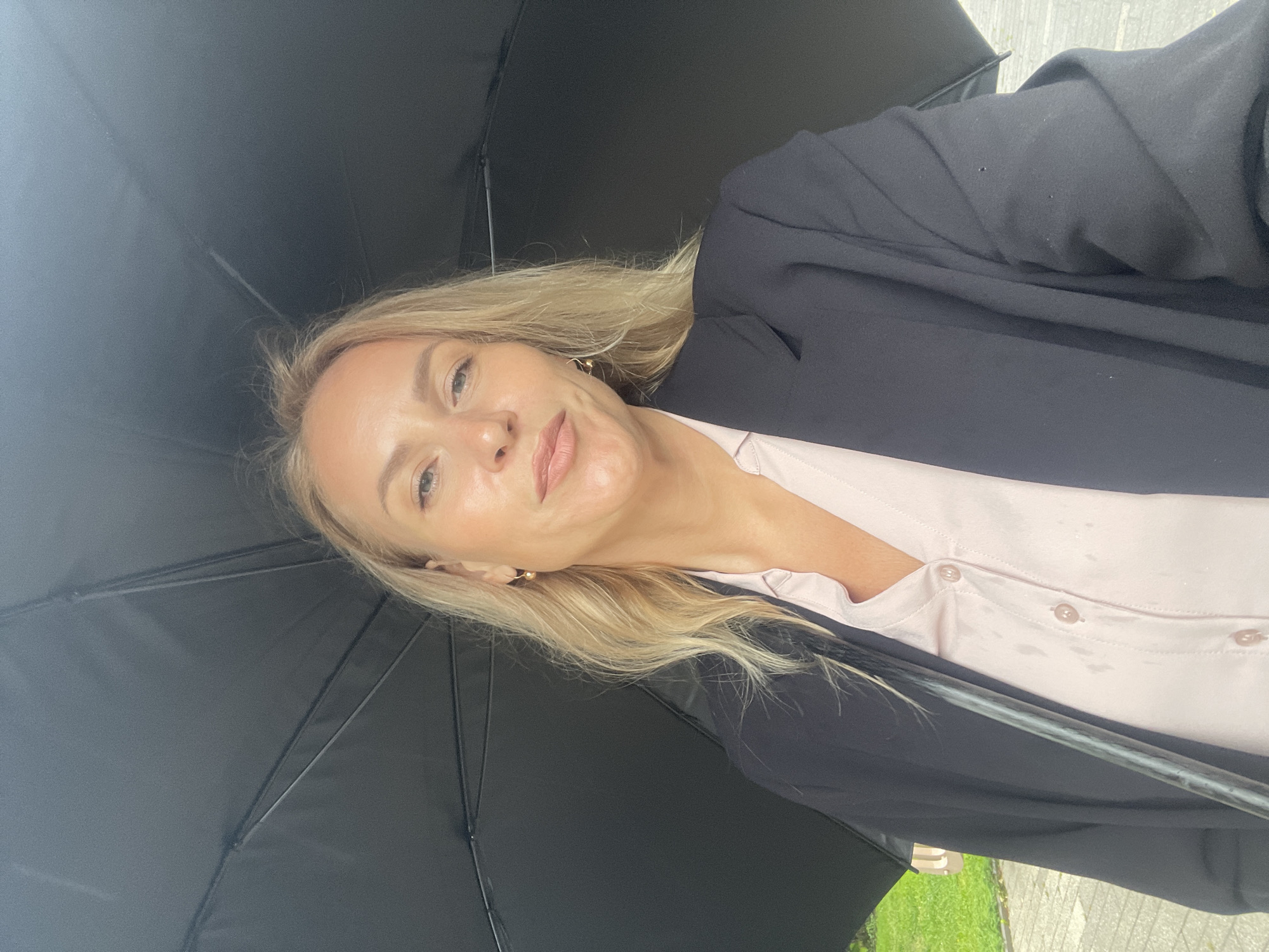 Woman with umbrella visits naval monuments during rain in Sochi