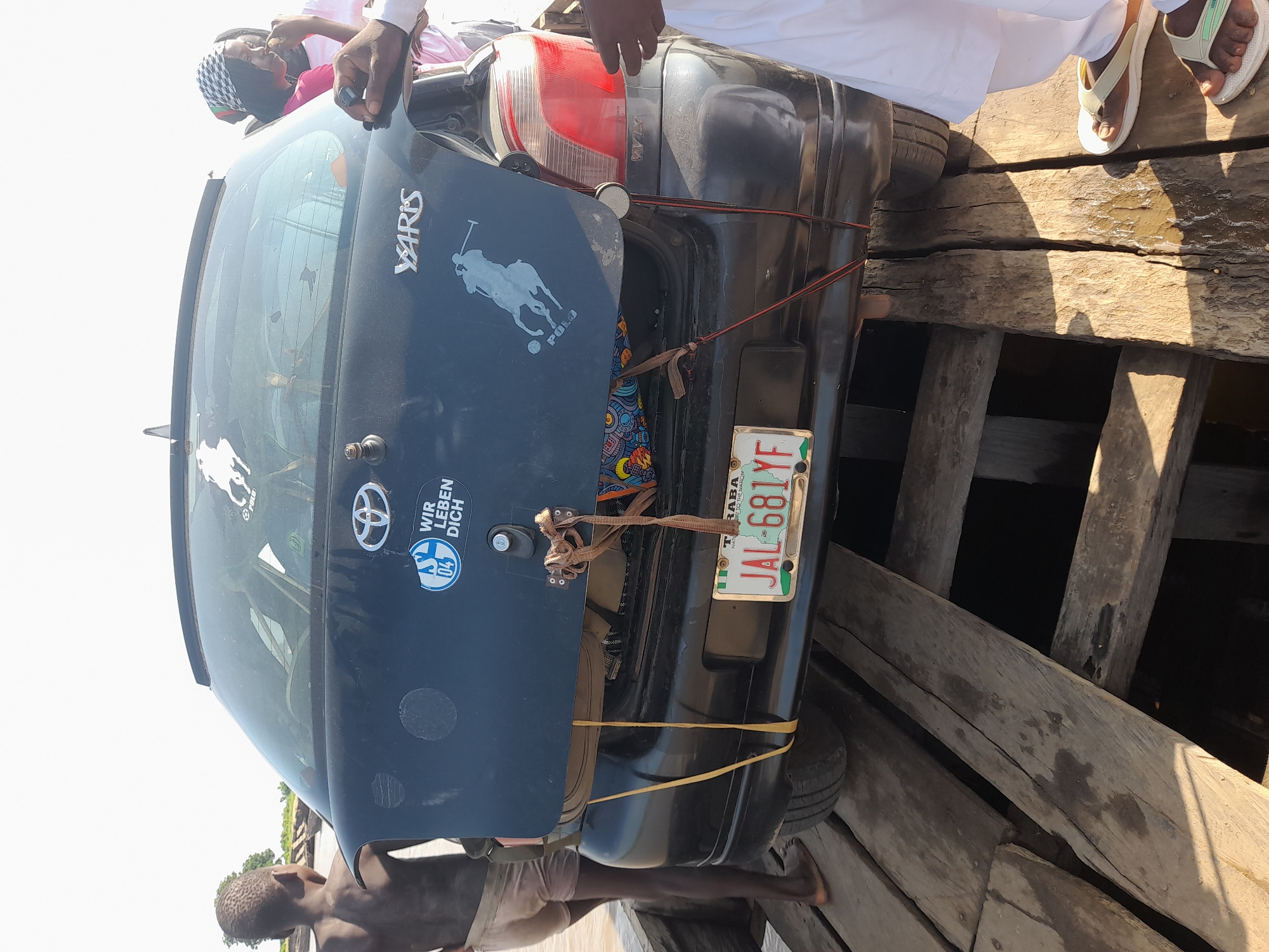 Ferry crossing and river activity at Nemnei, Nigeria