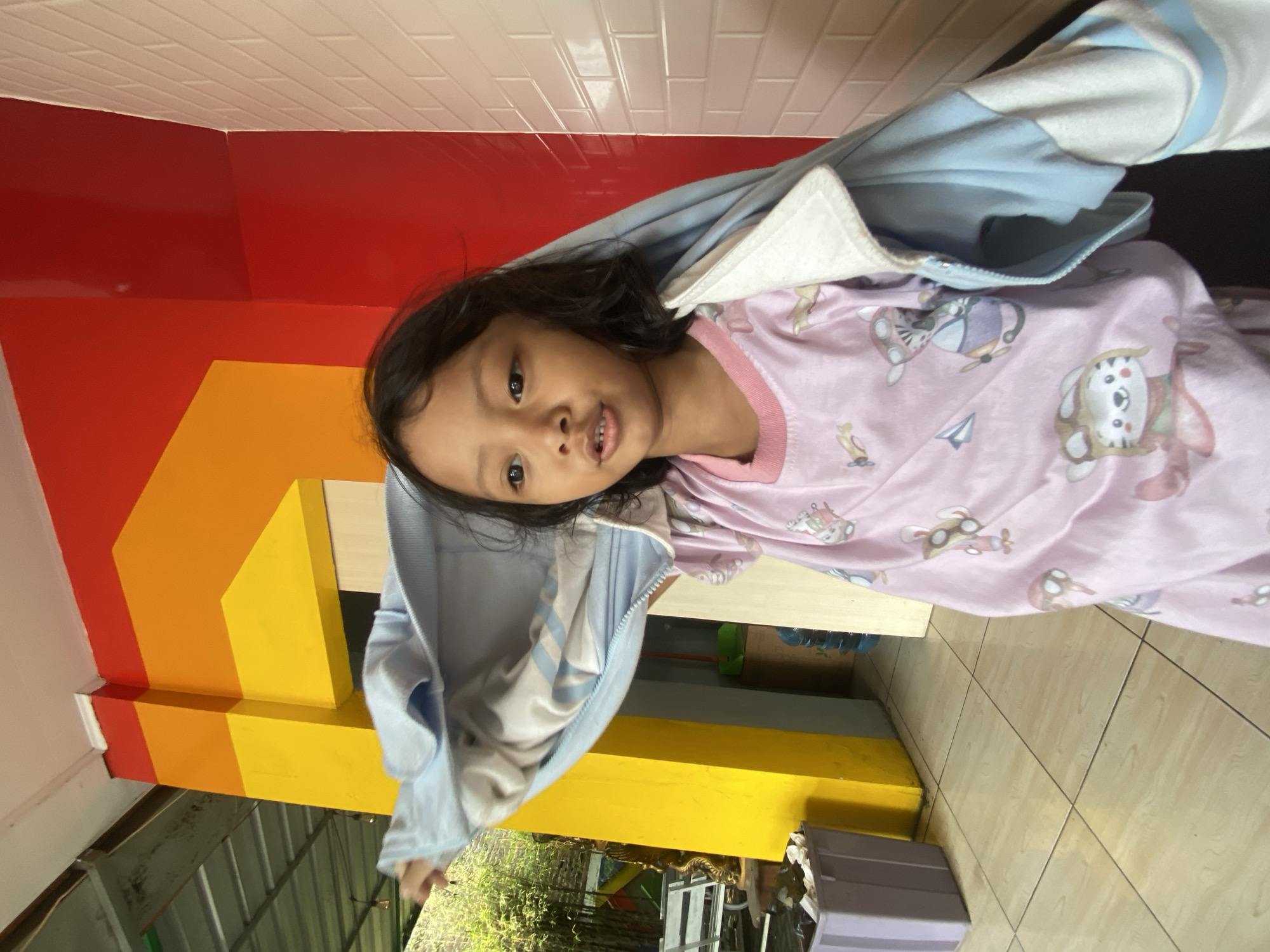 Young girl spotted around food stalls in Balonggabus, Indonesia