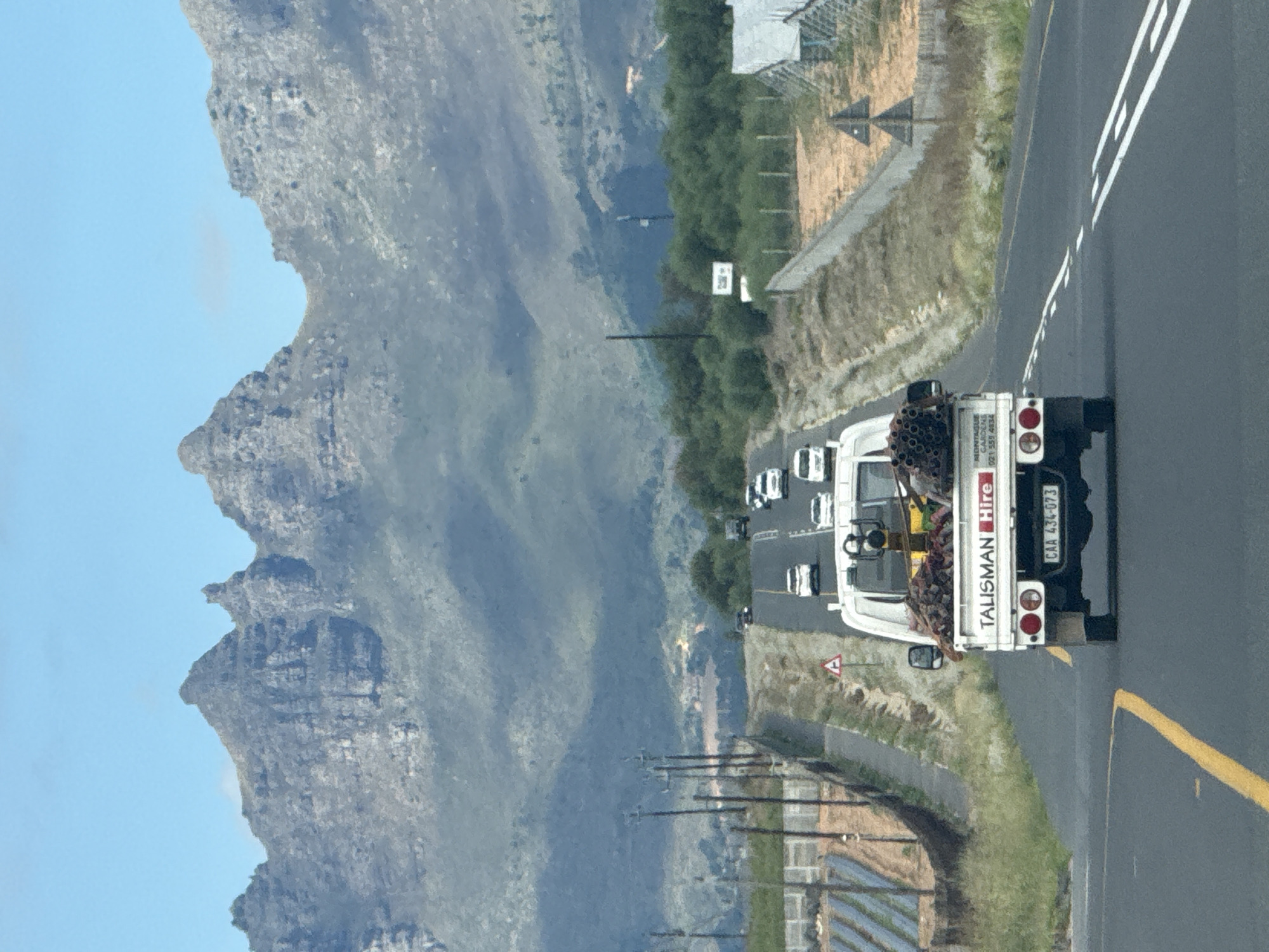 Talisman Hire truck travels mountain road in Stellenbosch