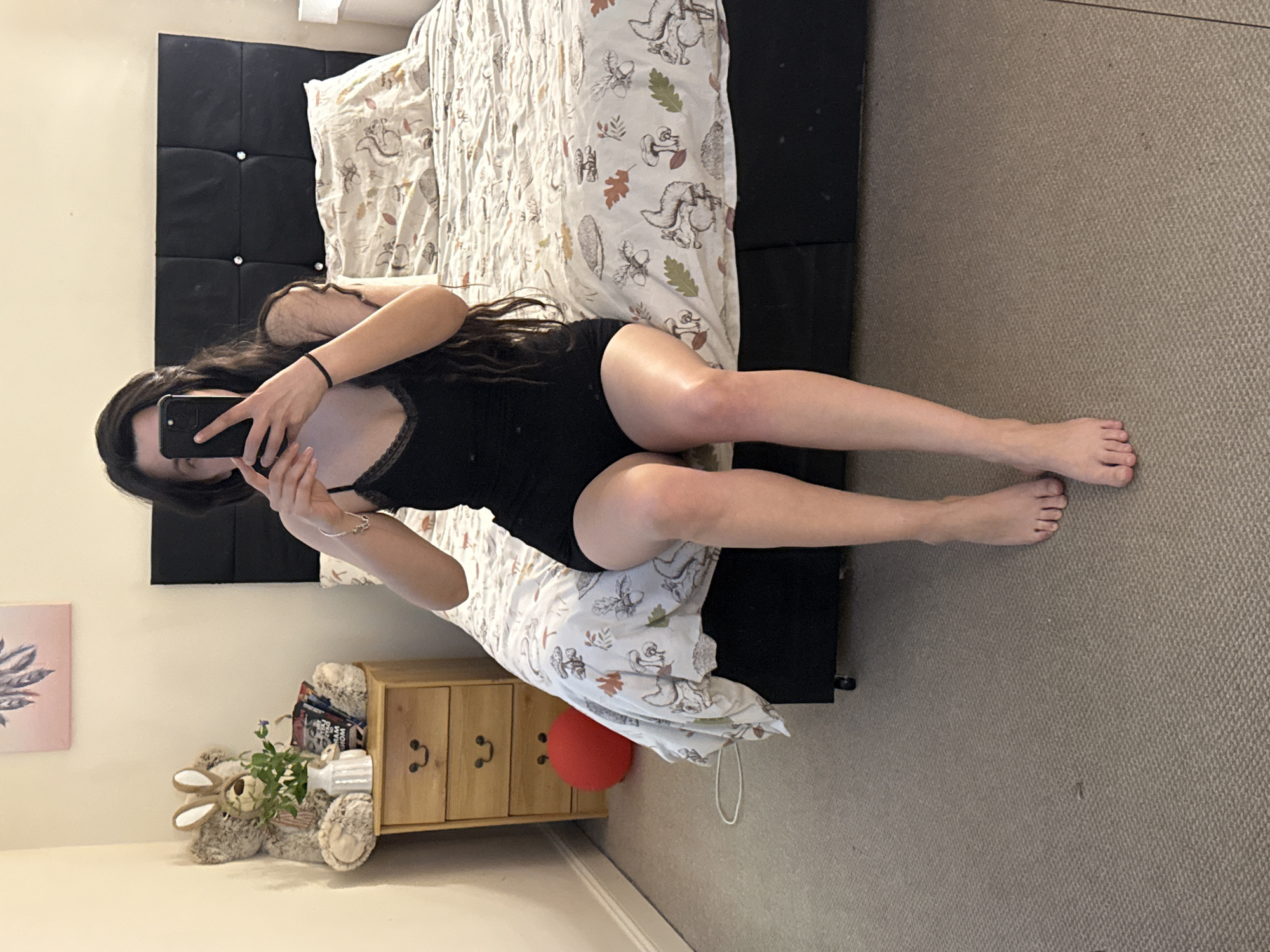 Woman takes selfie on bed in Great Yarmouth
