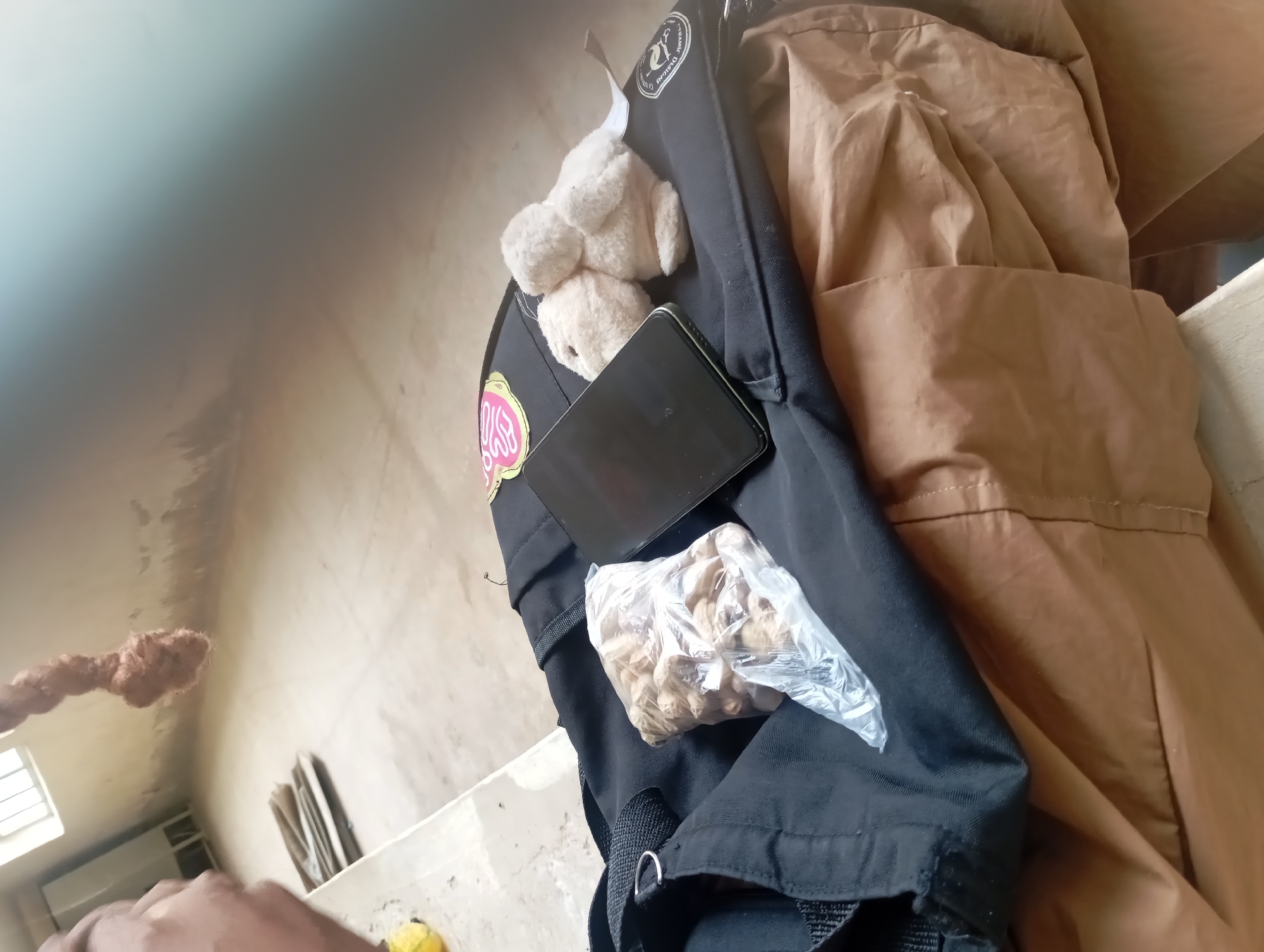 Backpack, books, and building details in a quick set of shots